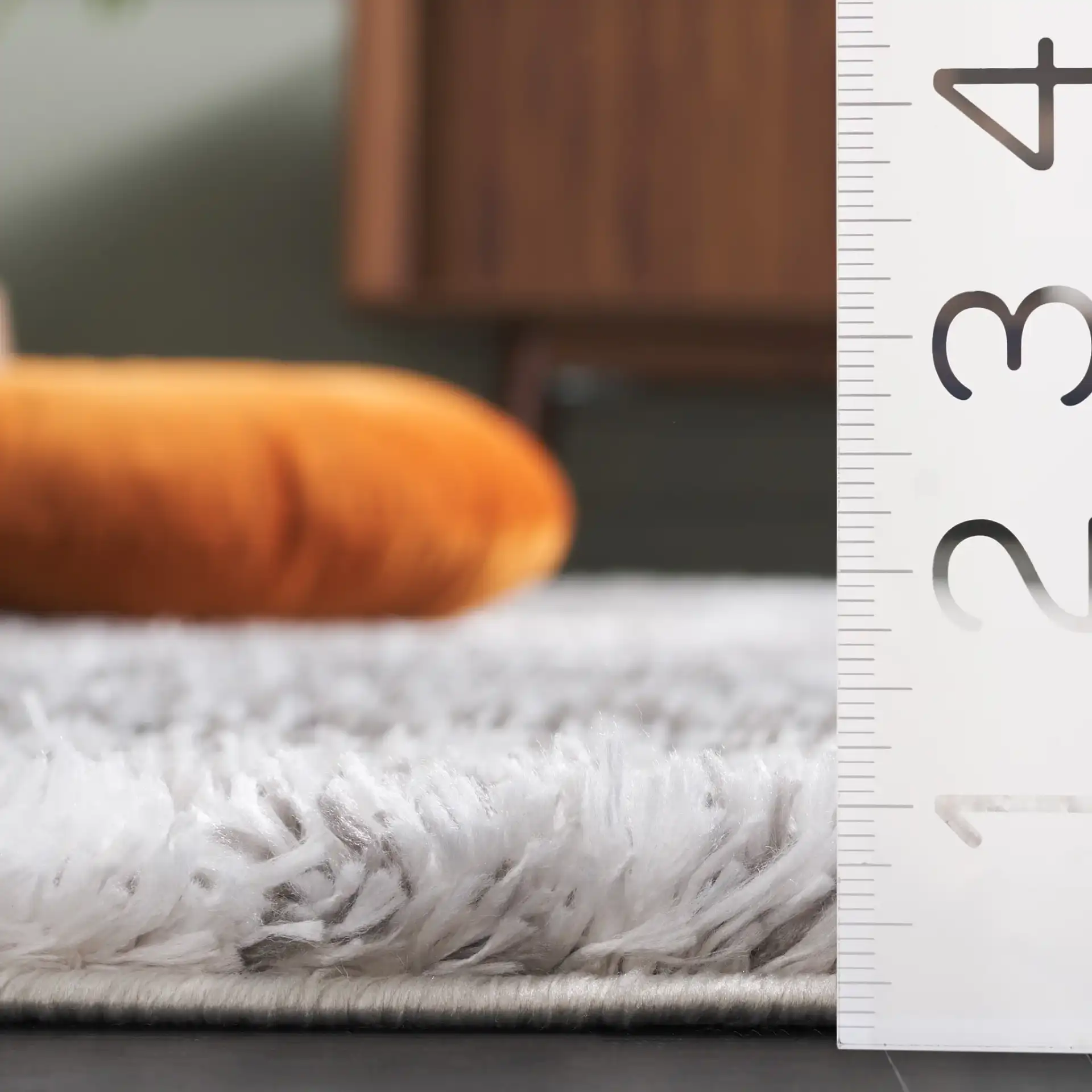 Penelope Striated Shag Rug in Gray / Ivory in a styled room