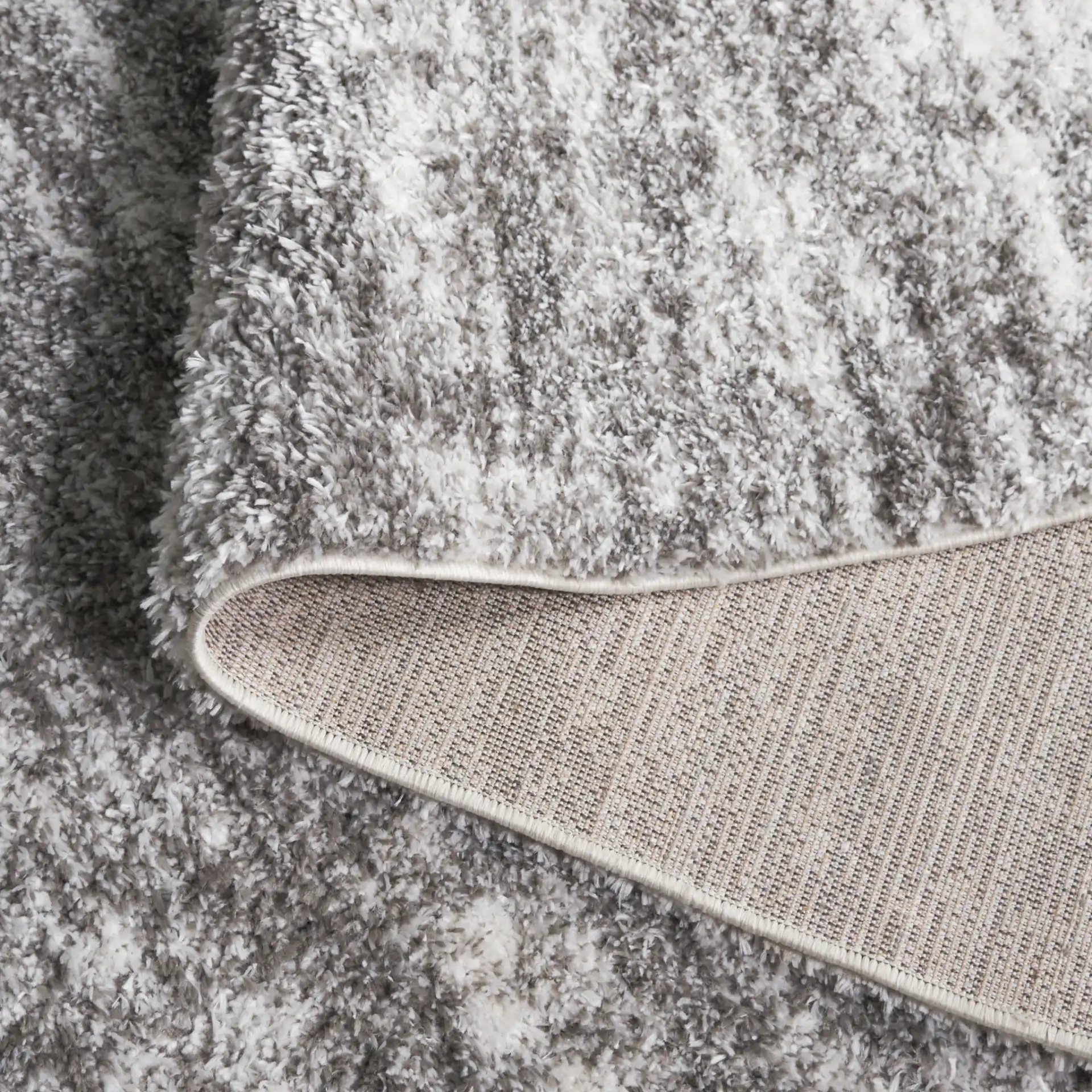 Penelope Striated Shag Rug in Gray / Ivory in a styled room