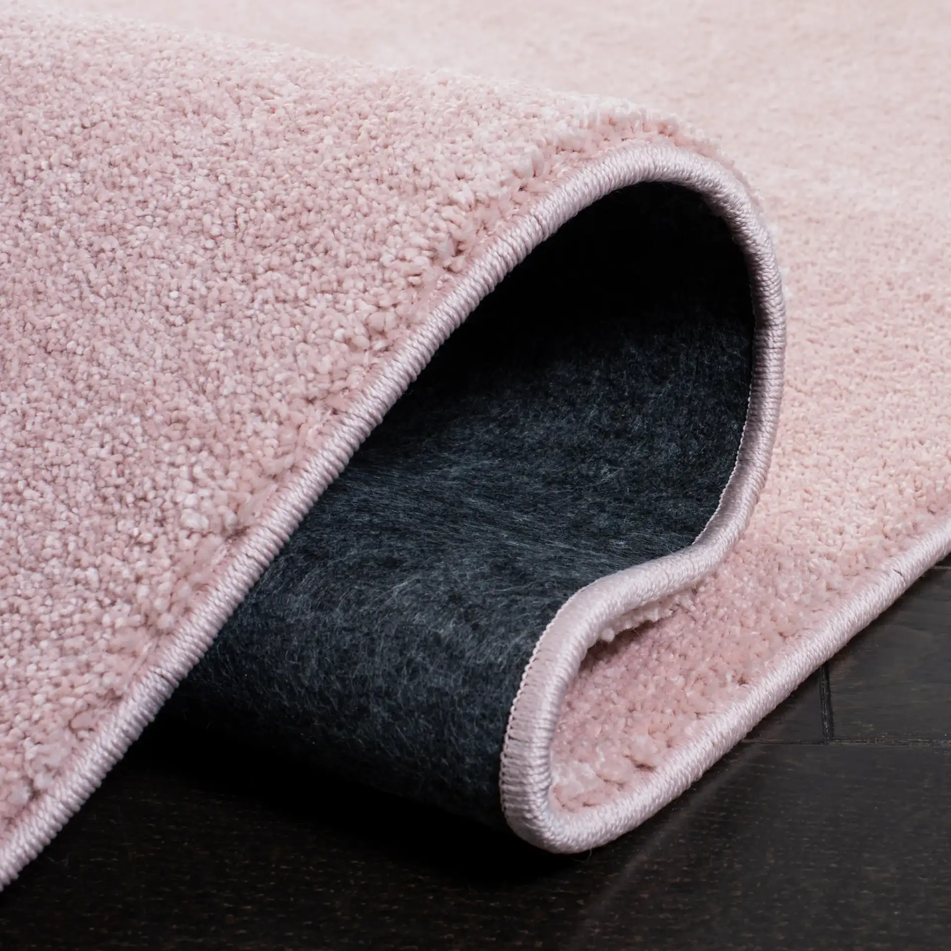 Pattern & Solid Pattern And Solid Textured Solid Rug in Pink in a styled room