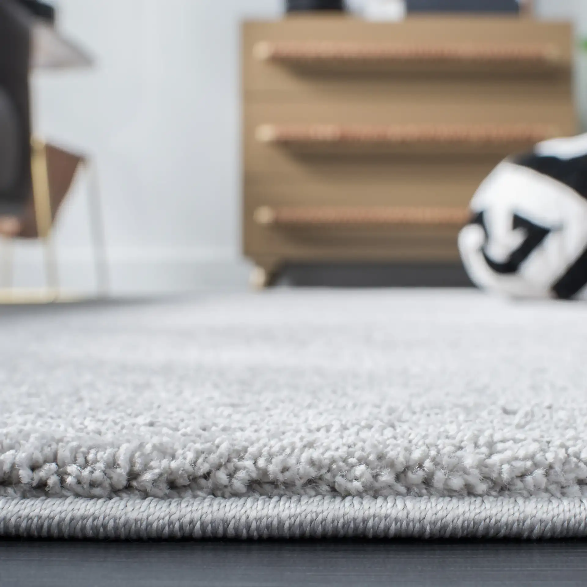 Pattern & Solid Pattern And Solid Textured Solid Rug in Light Gray in a styled room