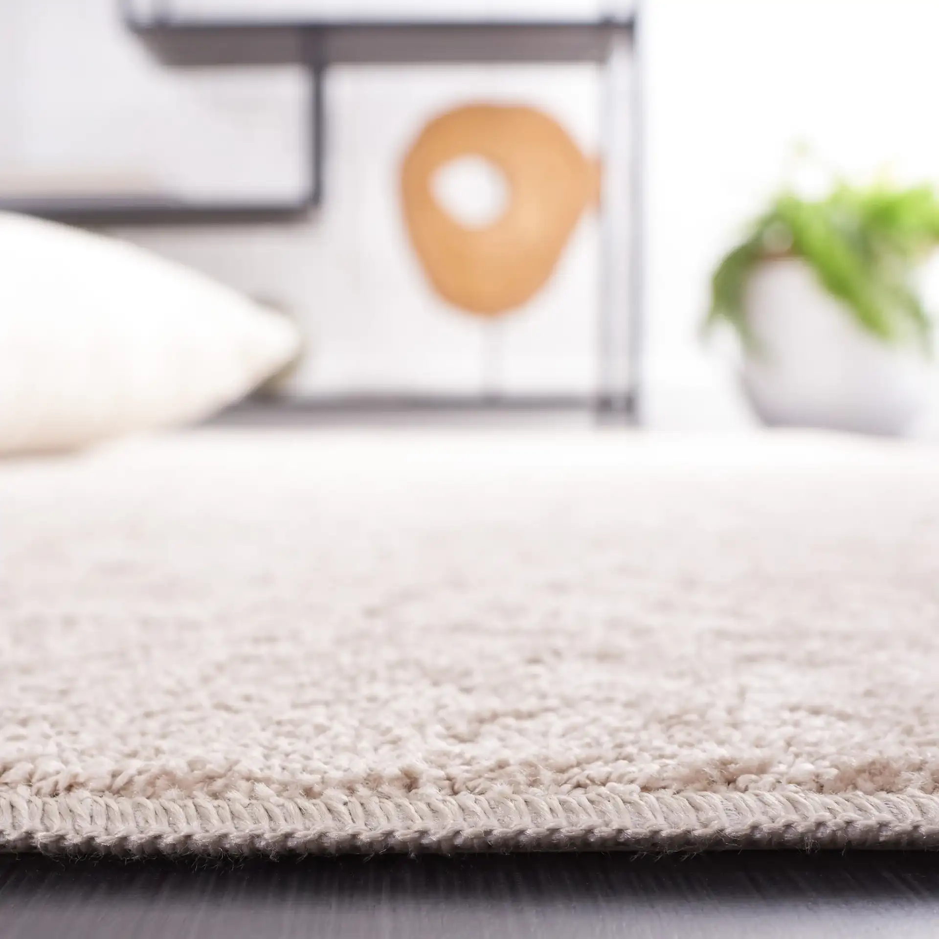 Pattern & Solid Pattern And Solid Spotted Rug in Beige in a styled room