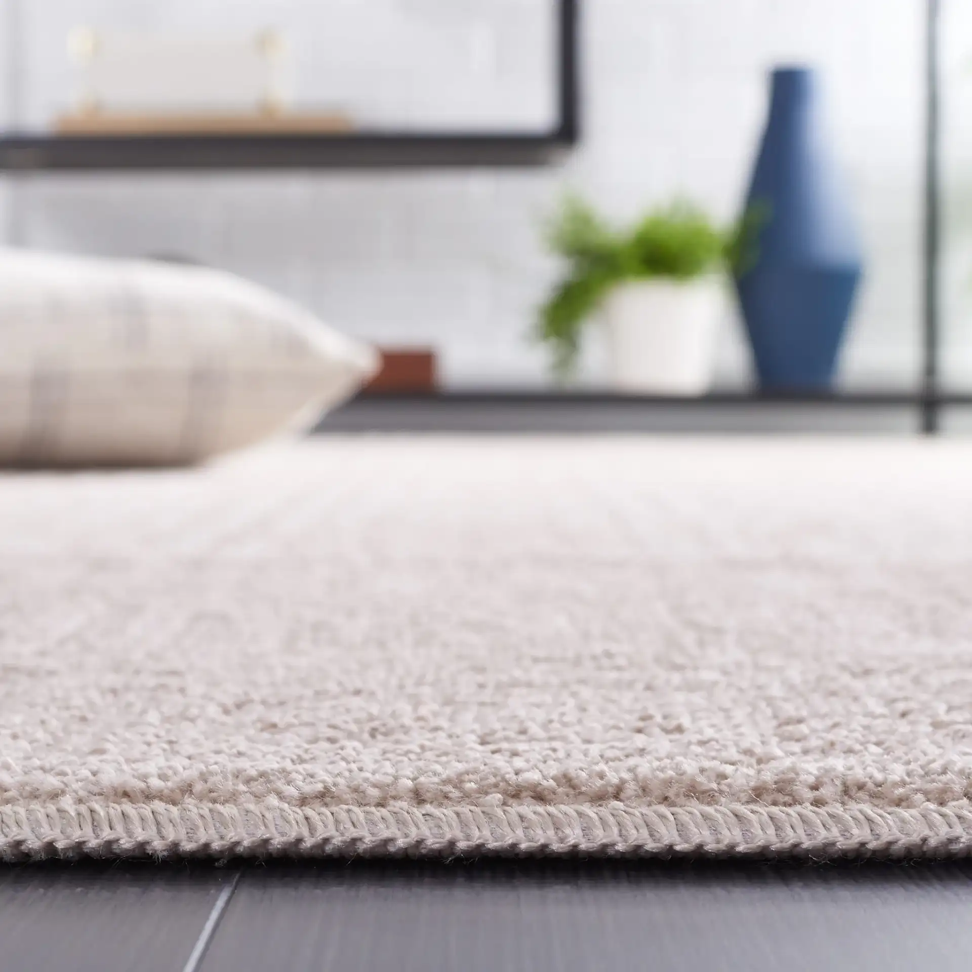 Pattern & Solid Pattern And Solid Greek Key Grid Rug in Beige in a styled room