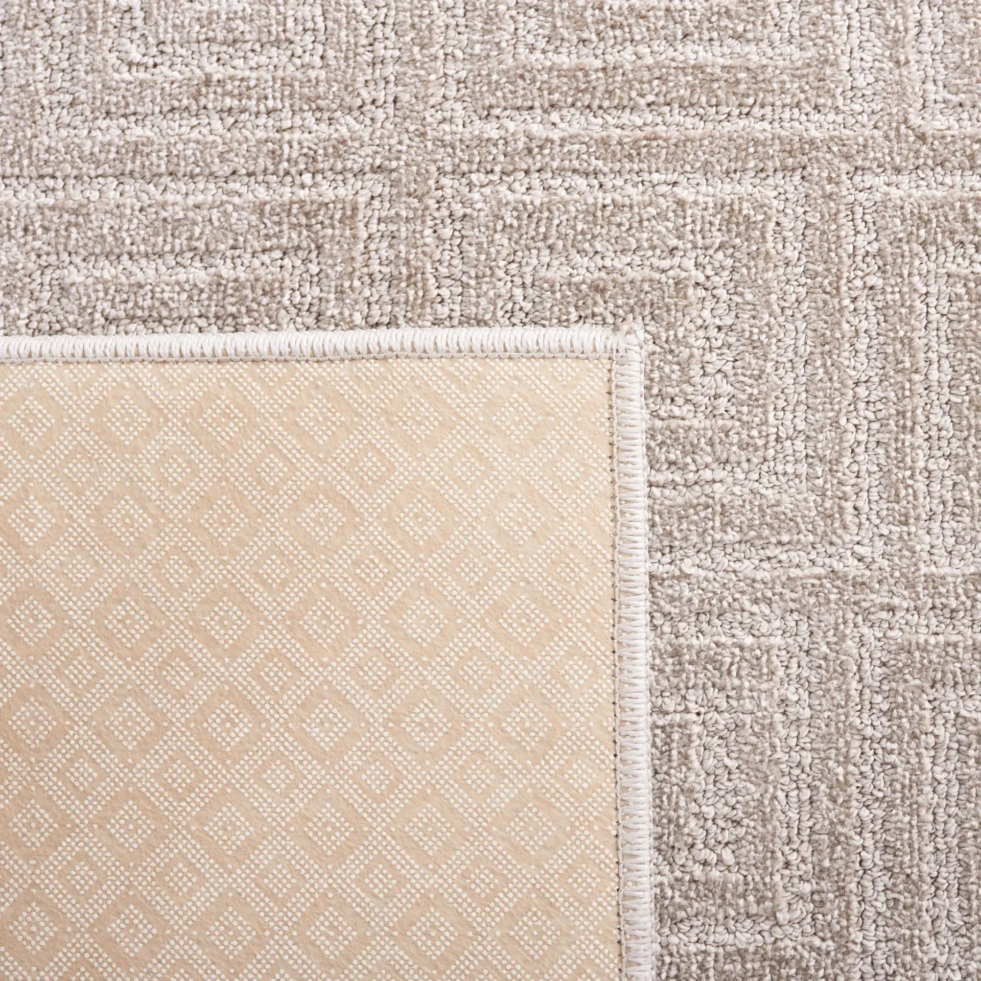 Pattern & Solid Pattern And Solid Greek Key Grid Rug in Beige in a styled room