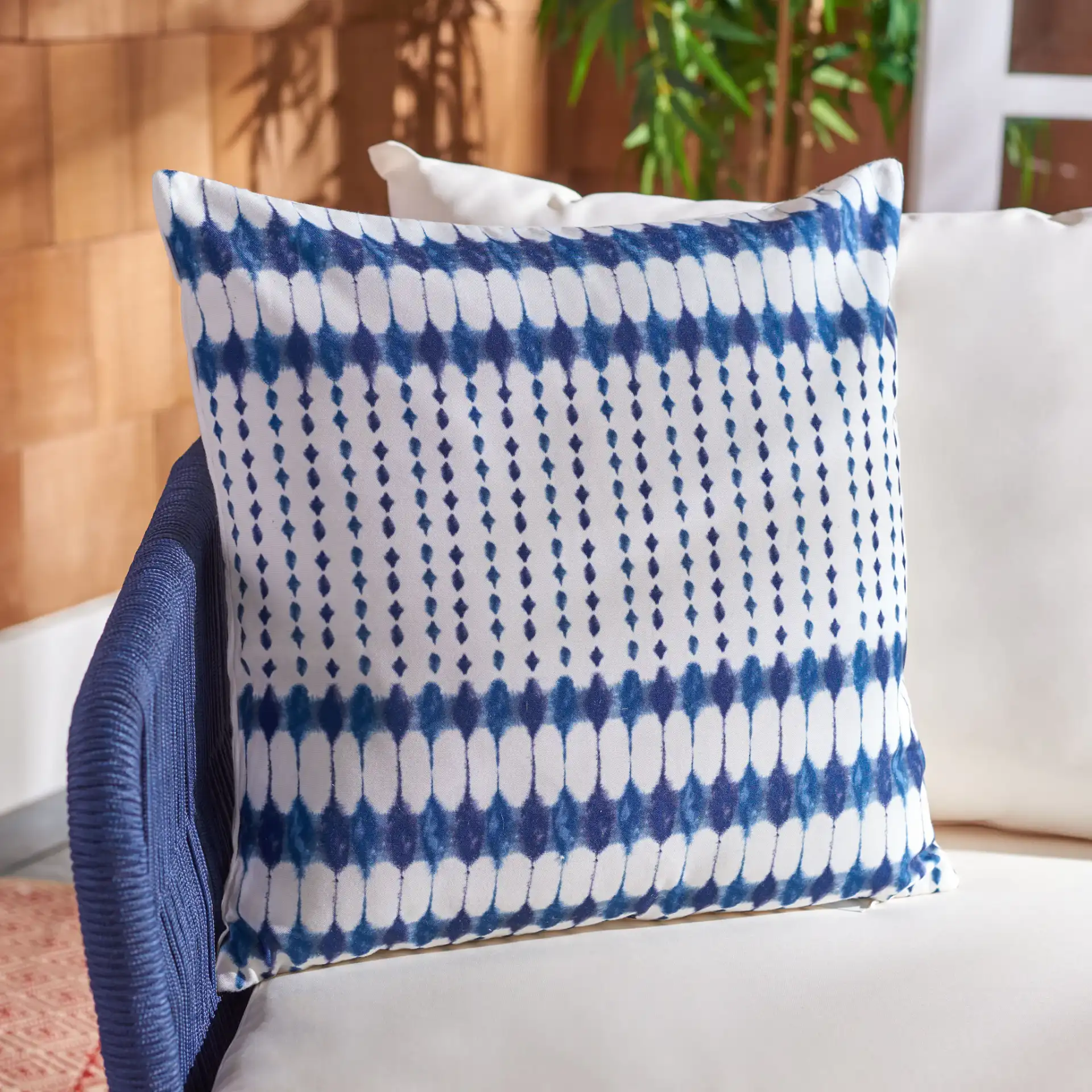 Indoor/Outdoor Kenza Pillow in Navy / White in a styled room
