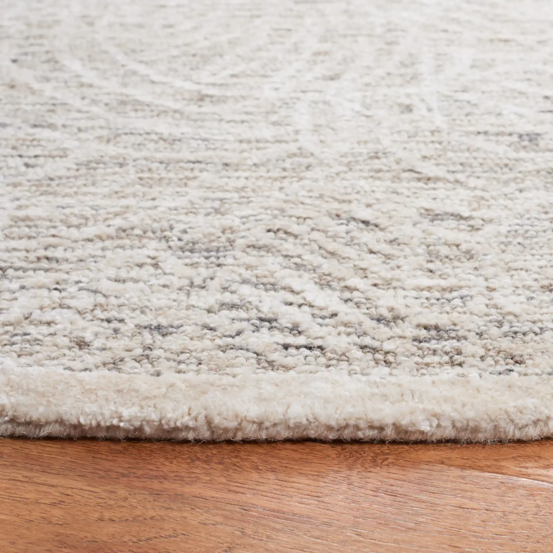 Precious Botanical Vine Hand-Tufted Rug in Gray / Ivory in a styled room