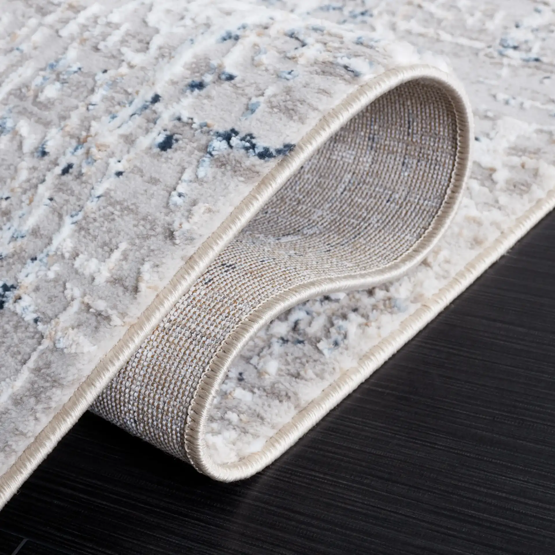 Parker Distressed Grid Rug in Taupe / Gray Blue in a styled room