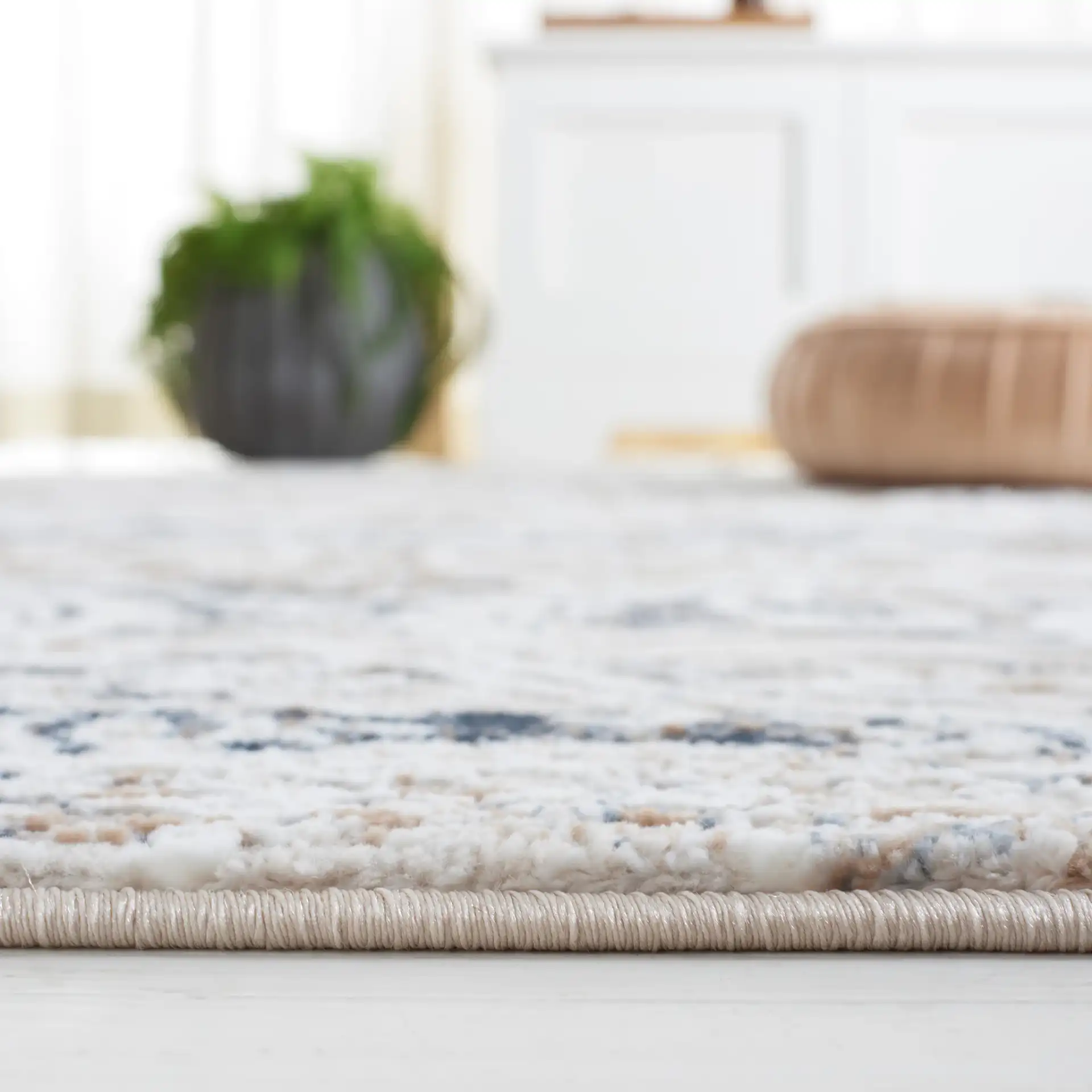 Parker Transitional Vintaged Damask Rug in Taupe / Ivory Gray in a styled room