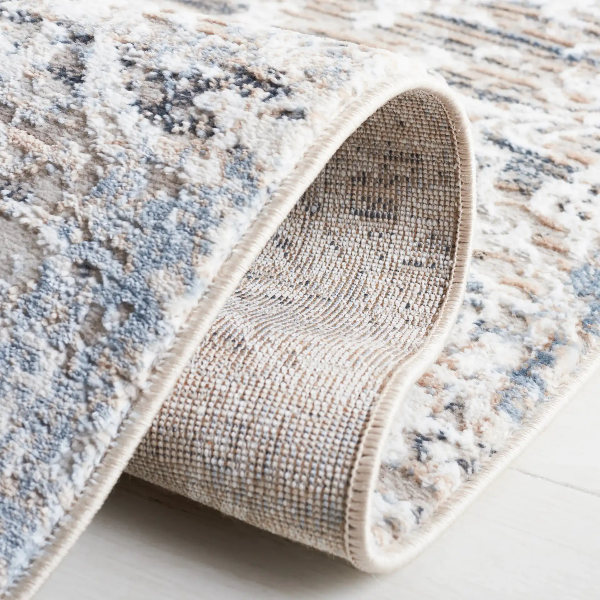 Parker Transitional Vintaged Damask Rug in Taupe / Ivory Gray in a styled room