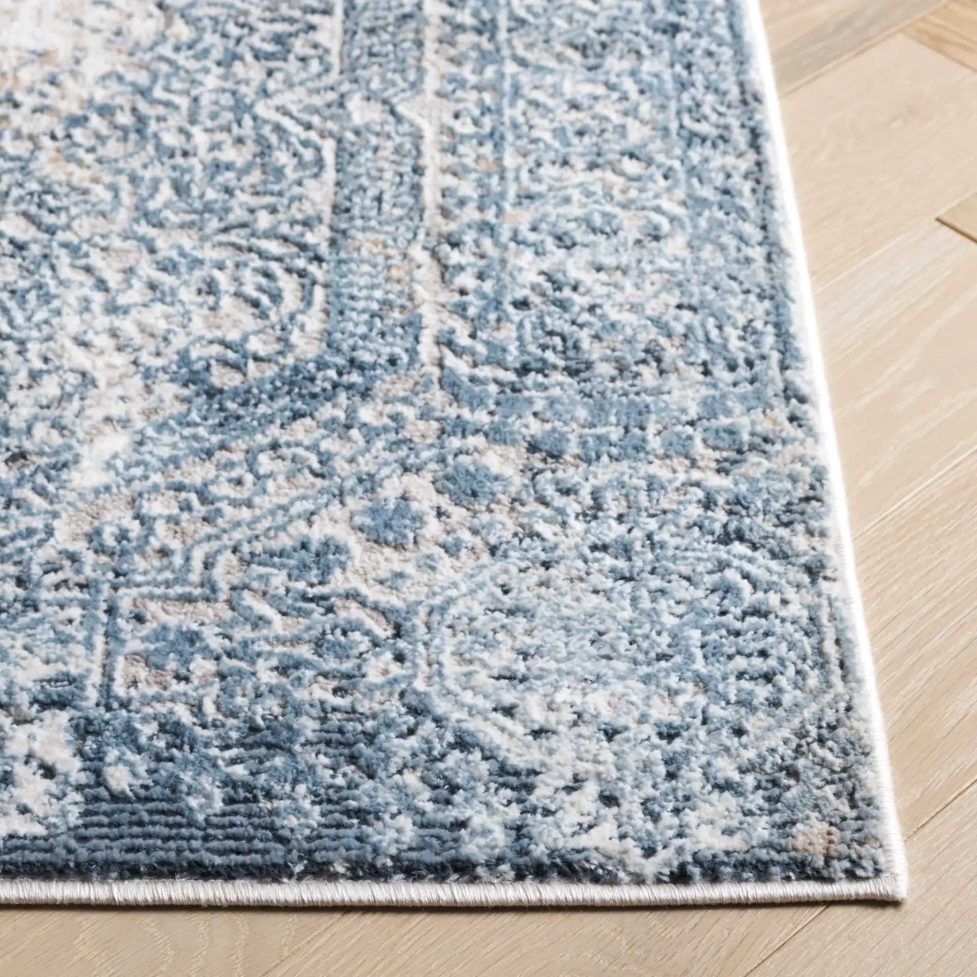 Parker Distressed Panel Rug in Blue / Taupe in a styled room