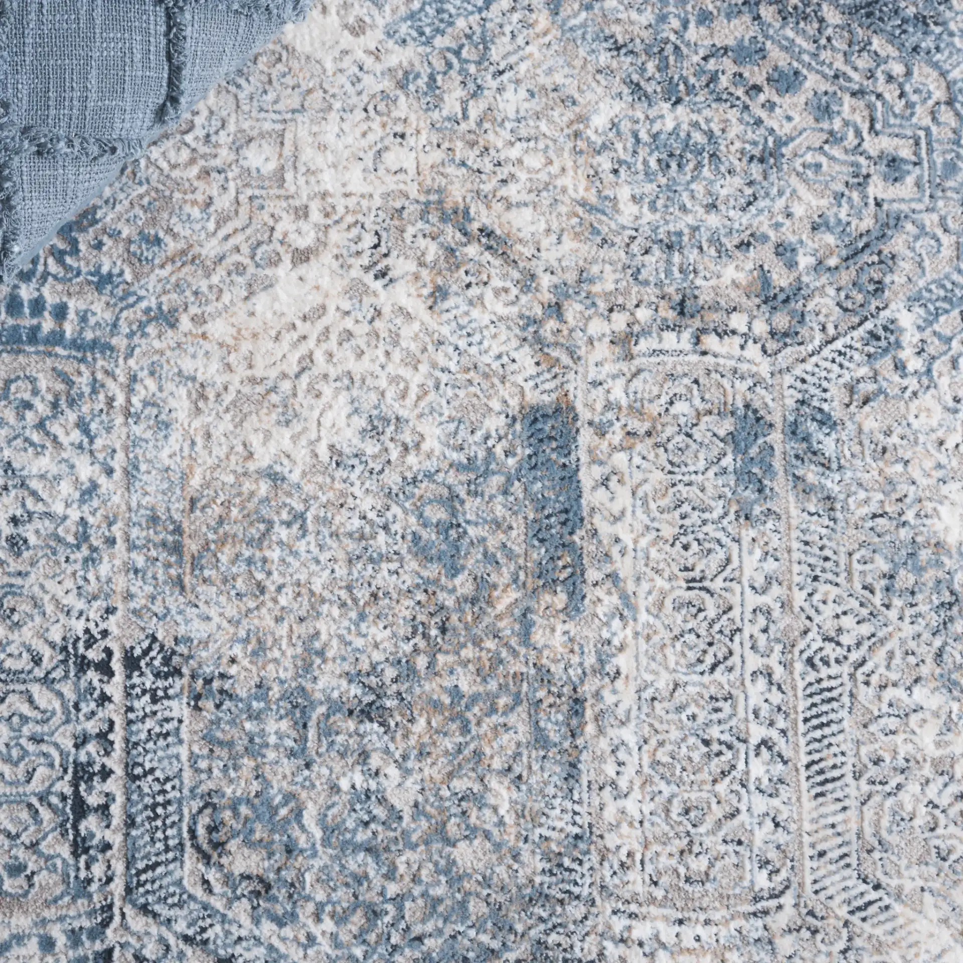 Parker Distressed Panel Rug in Blue / Taupe in a styled room