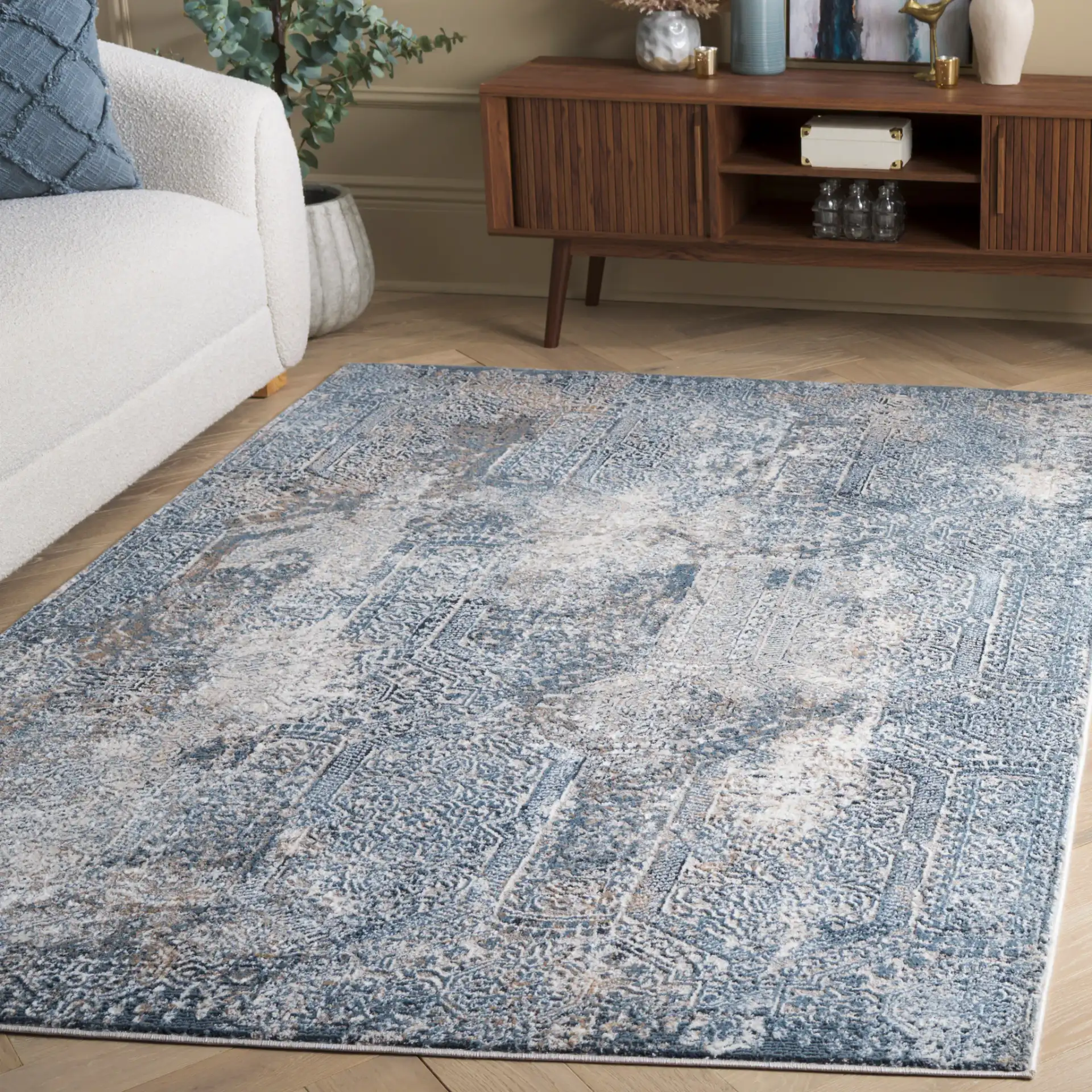 Parker Distressed Panel Rug in Blue / Taupe in a styled room