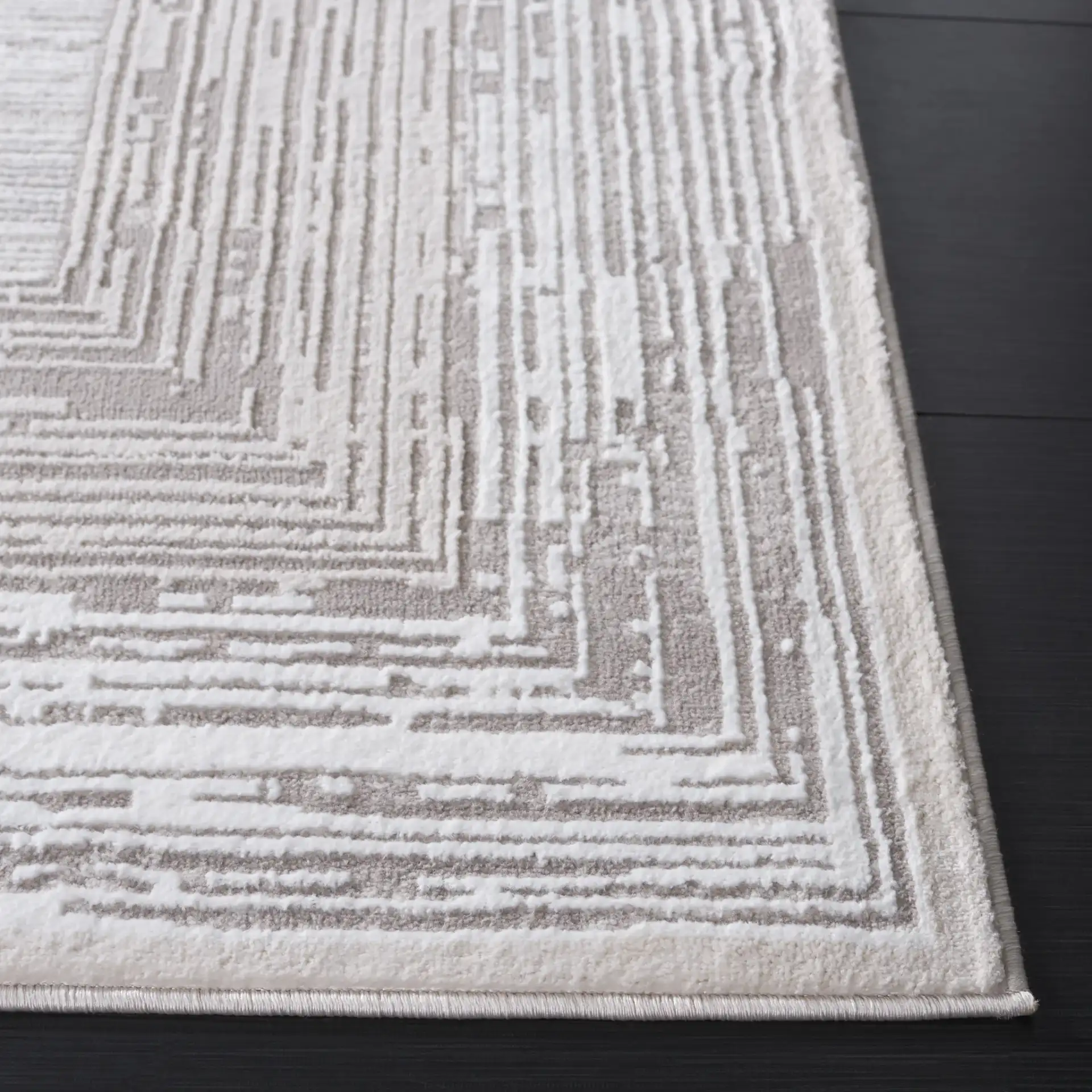 Parker Concentric Border Rug in Taupe / Gray Ivory in a styled room