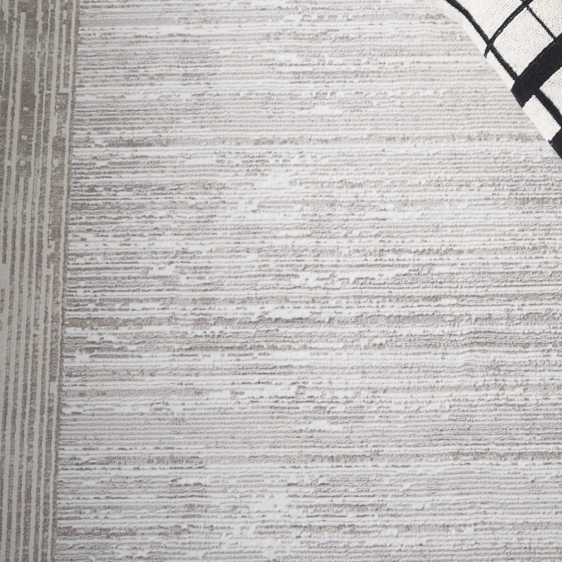 Parker Concentric Border Rug in Taupe / Gray Ivory in a styled room