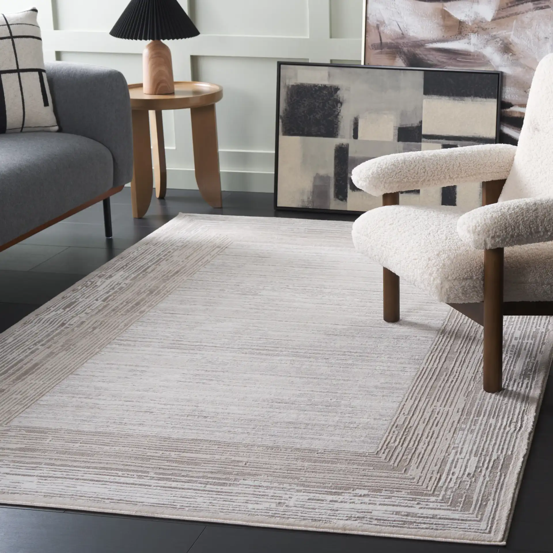 Parker Concentric Border Rug in Taupe / Gray Ivory in a styled room