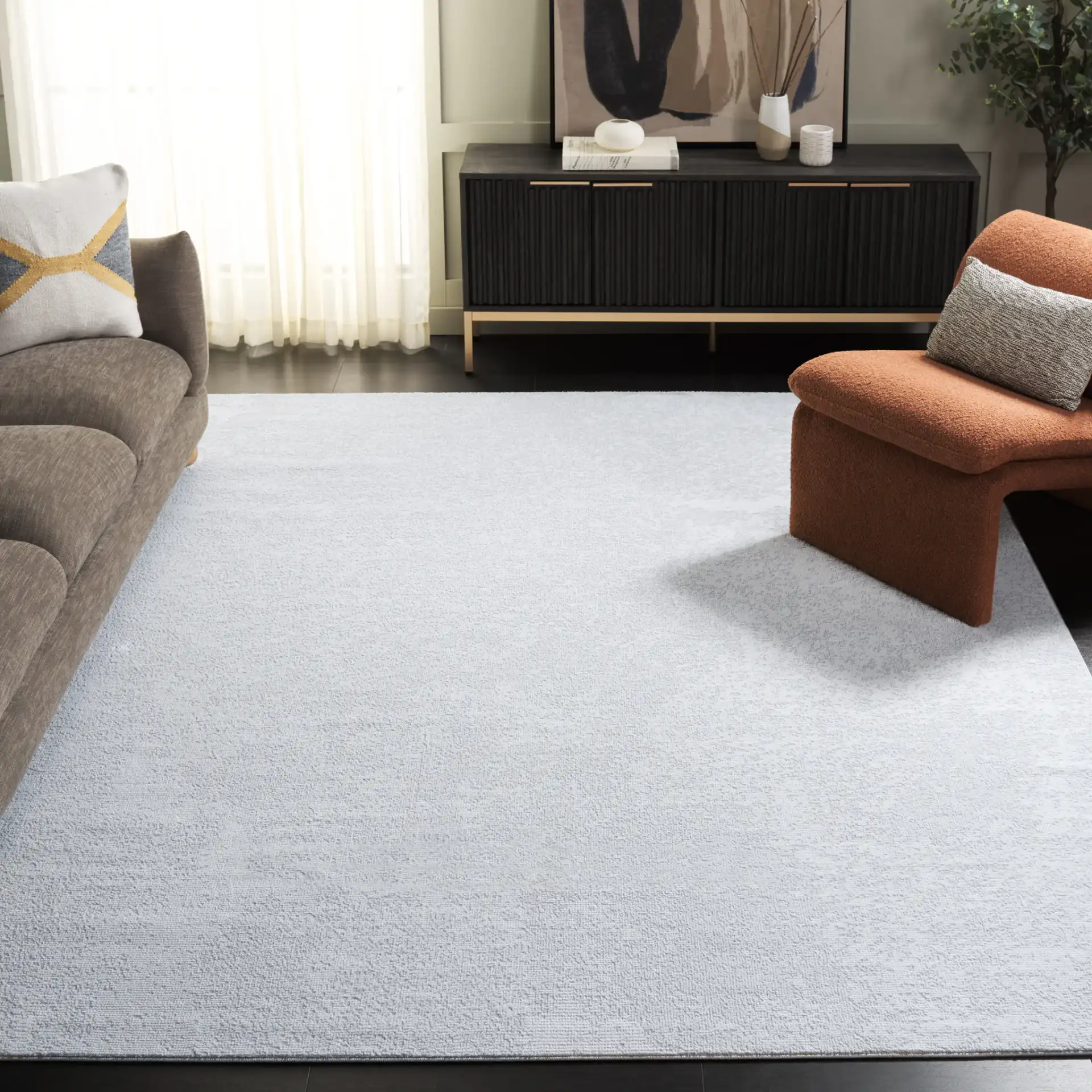 Parker Textured Solid Rug in Gray / Light Gray in a styled room