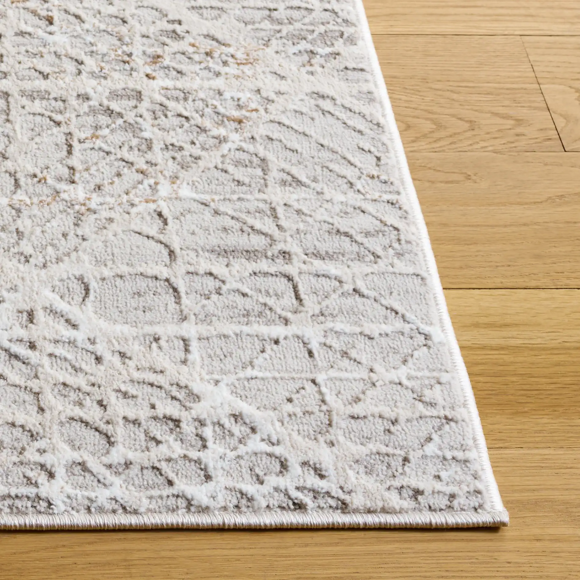 Parker Distressed Diamond Trellis Rug in Taupe / Gray Ivory in a styled room