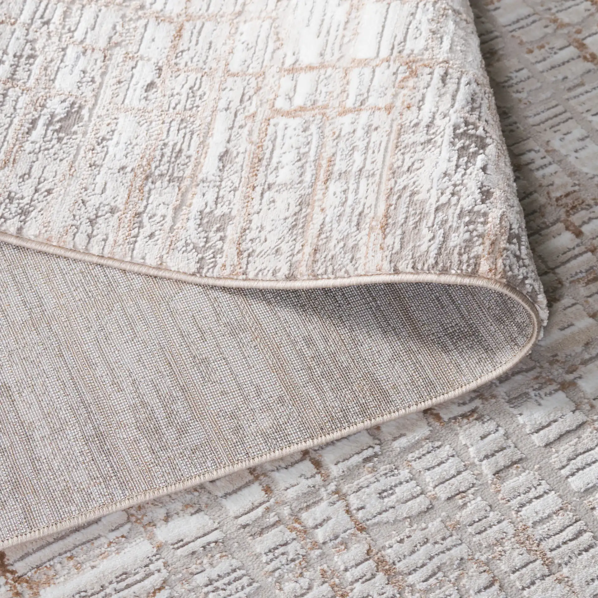 Parker Grid Border Rug in Taupe / Beige Gold in a styled room