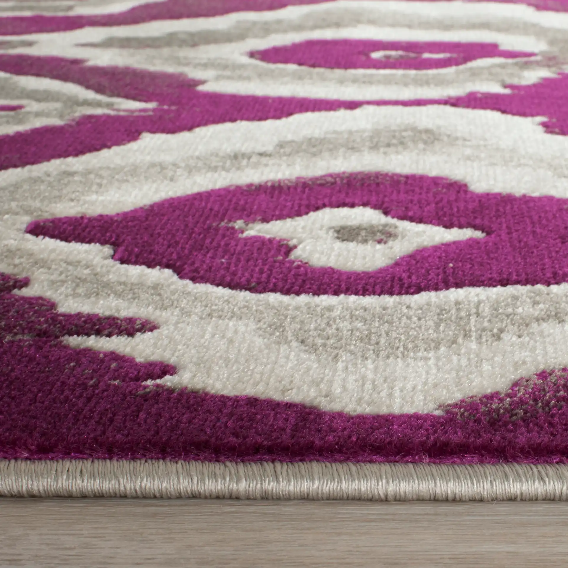 Porcello Ikat Diamond Rug in Ivory / Purple in a styled room