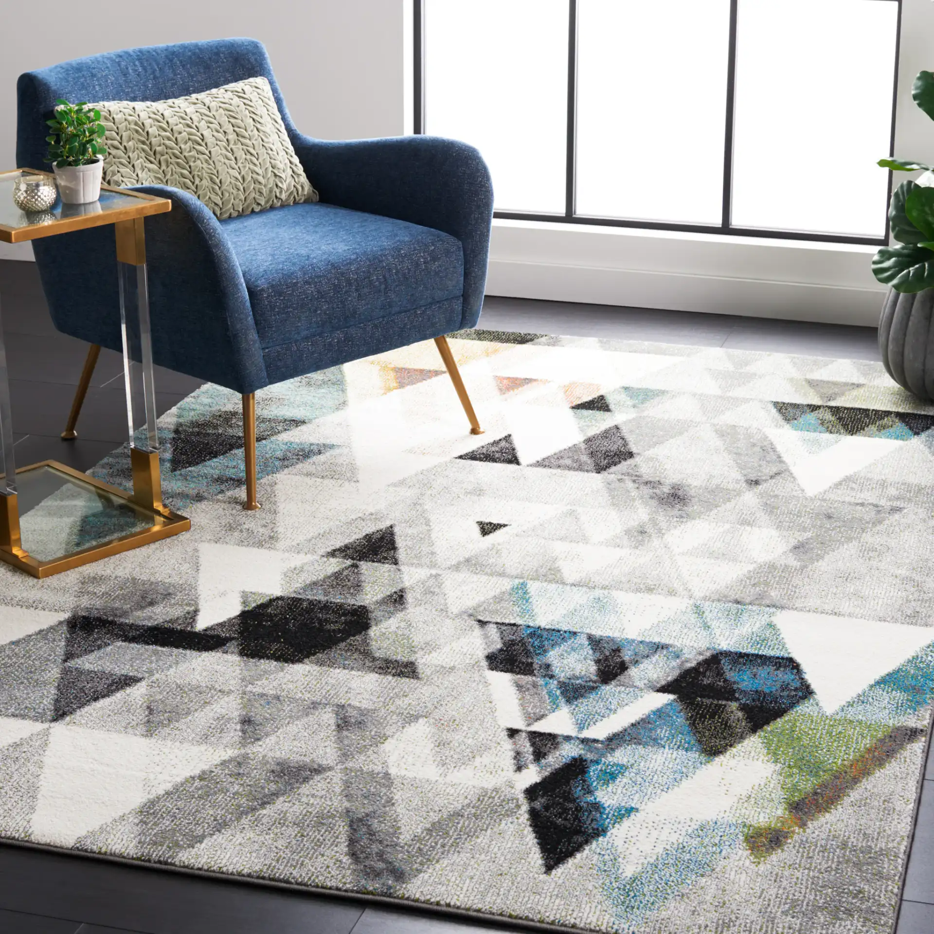 Porcello Overlapping Triangles Rug in Gray / Blue in a styled room
