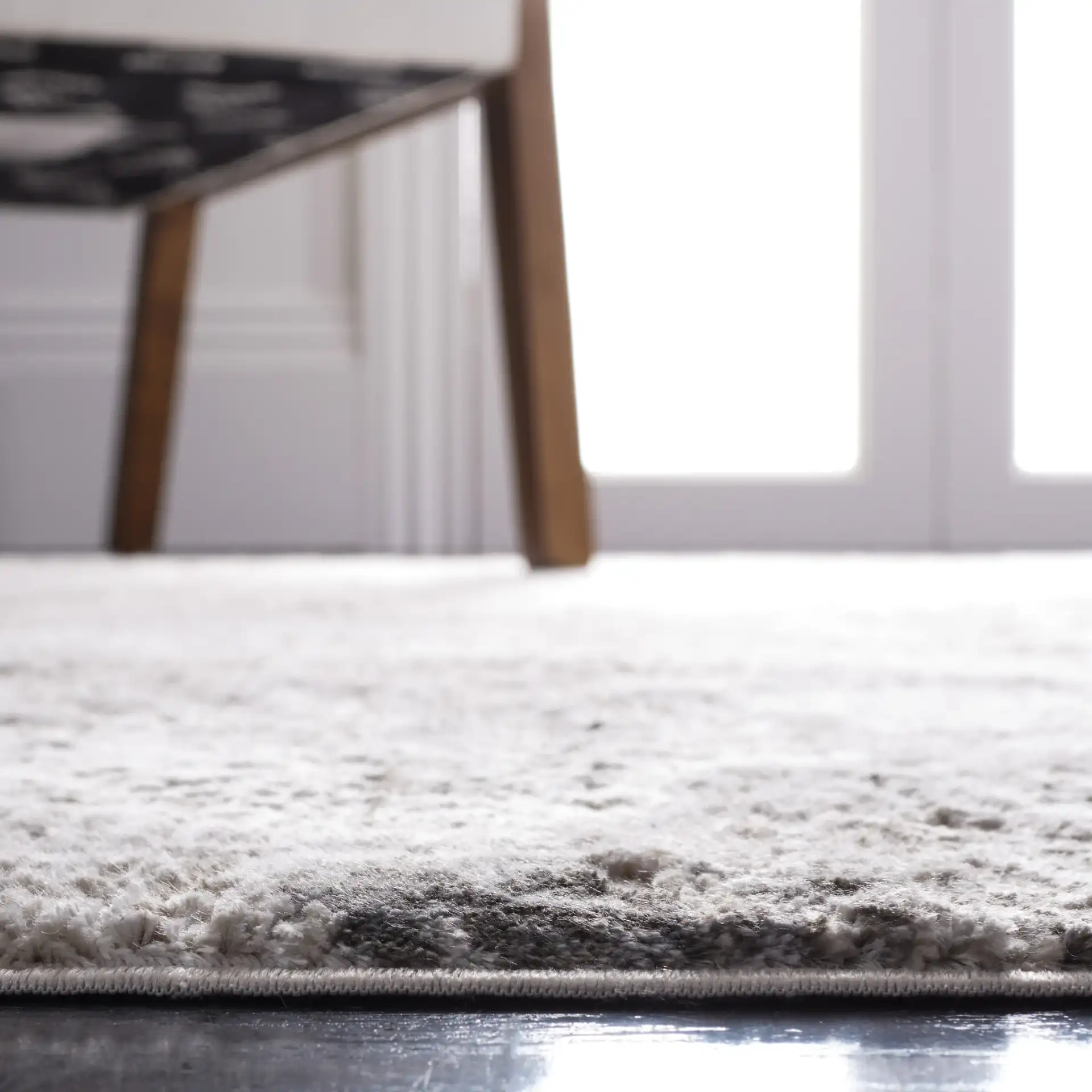 Princeton Distressed Abstract Rug in Ivory / Gray in a styled room