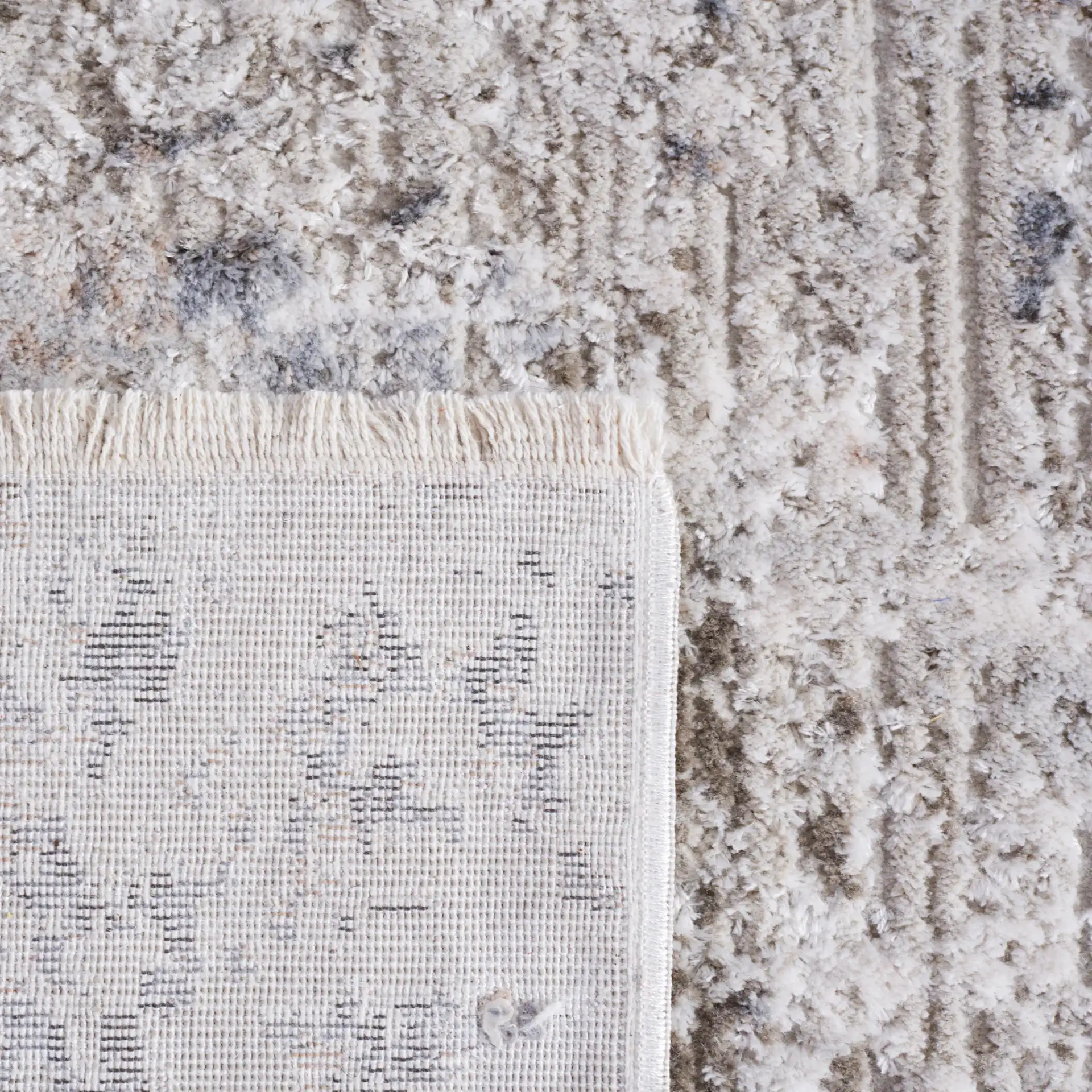 Princeton Distressed Abstract Rug in Ivory / Gray in a styled room
