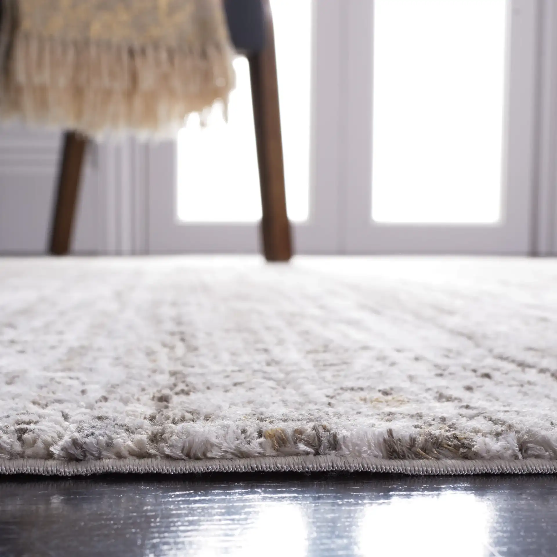 Princeton Distressed Grid Rug in Ivory / Gray in a styled room