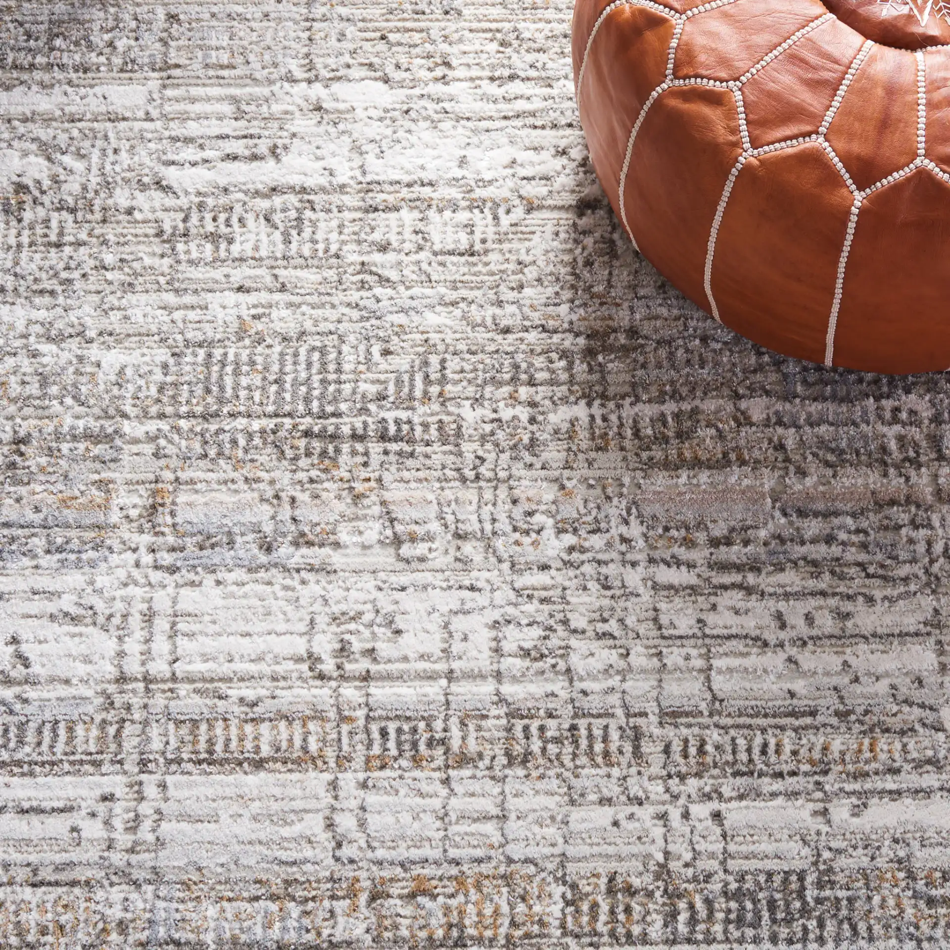 Princeton Distressed Grid Rug in Ivory / Gray in a styled room
