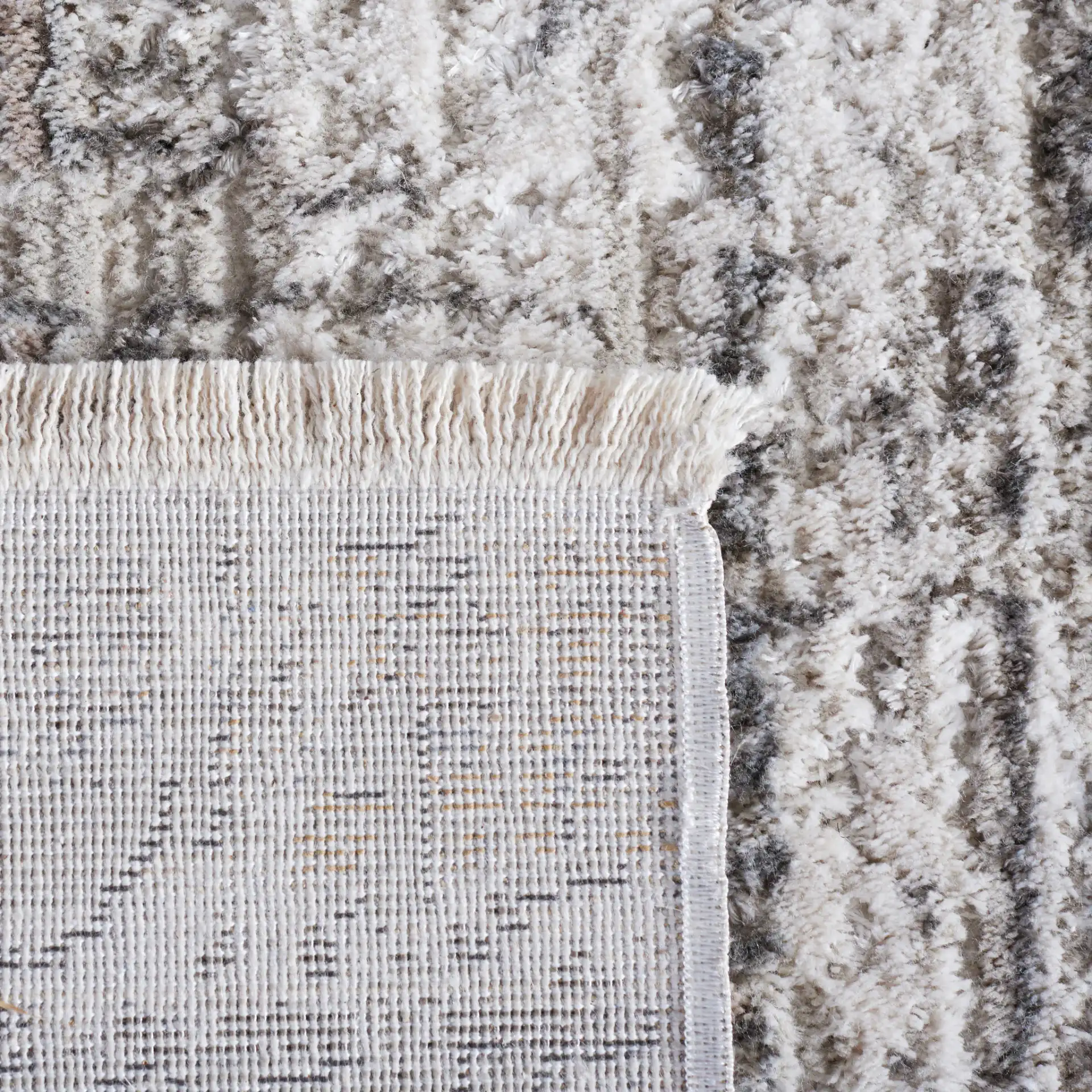 Princeton Distressed Grid Rug in Ivory / Gray in a styled room