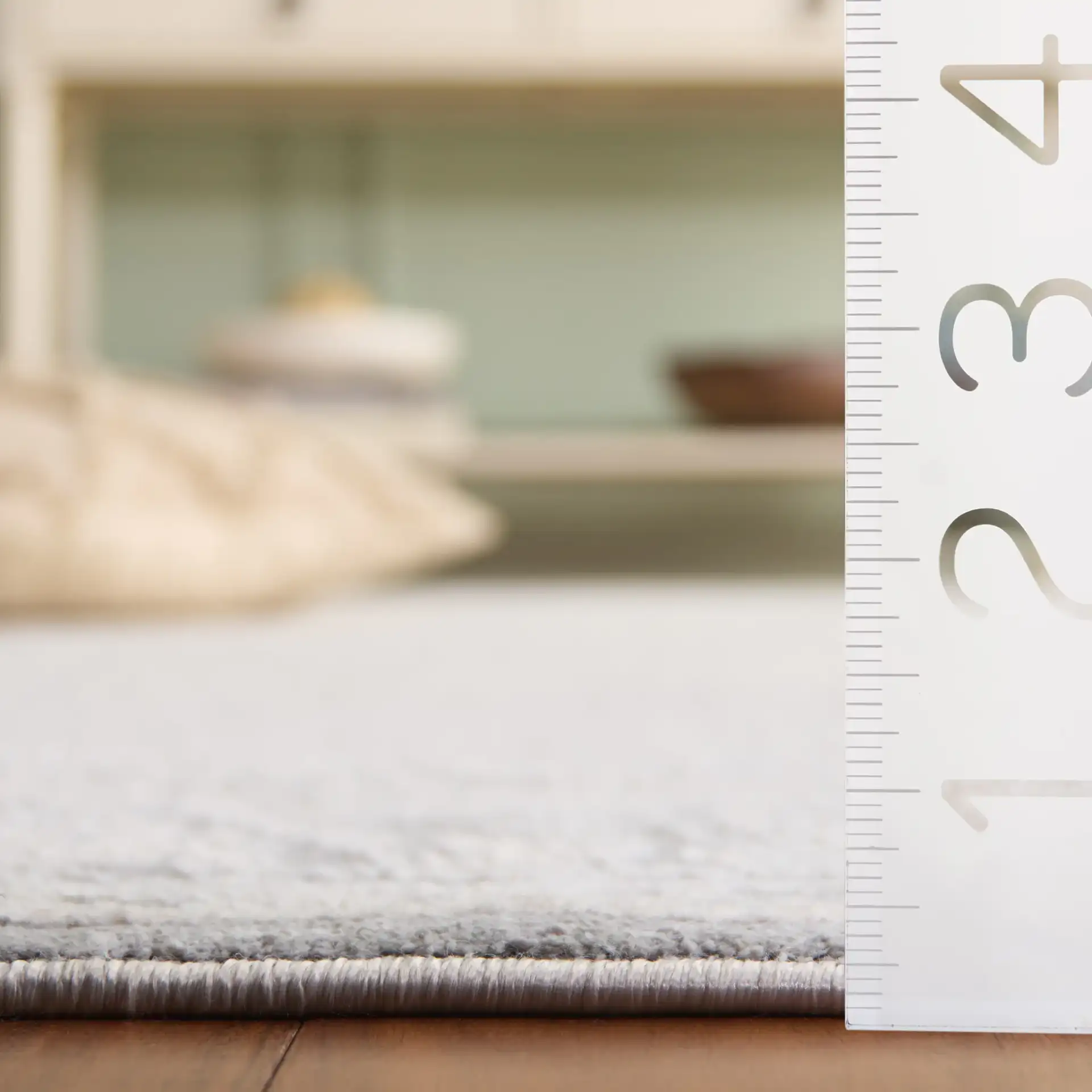 Princeton Distressed Panel Rug in Gray / Beige in a styled room