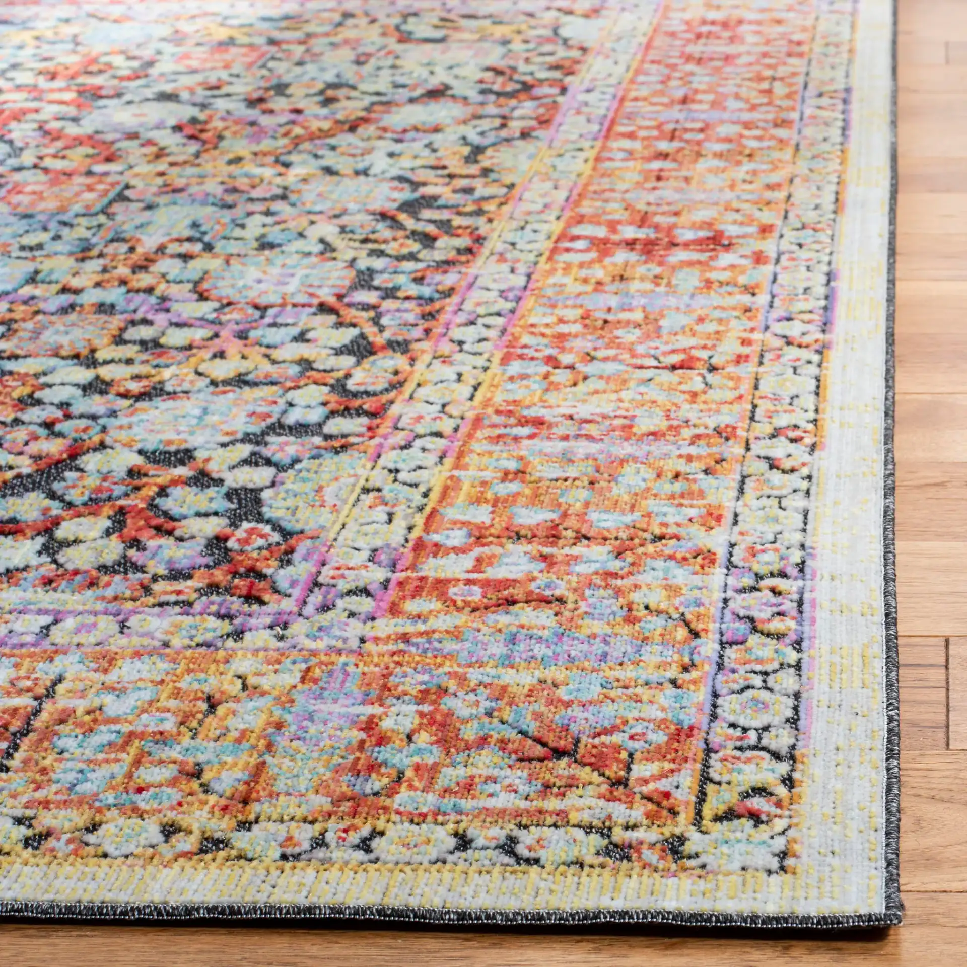 Provance Botanical Border Rug in Red / Black in a styled room