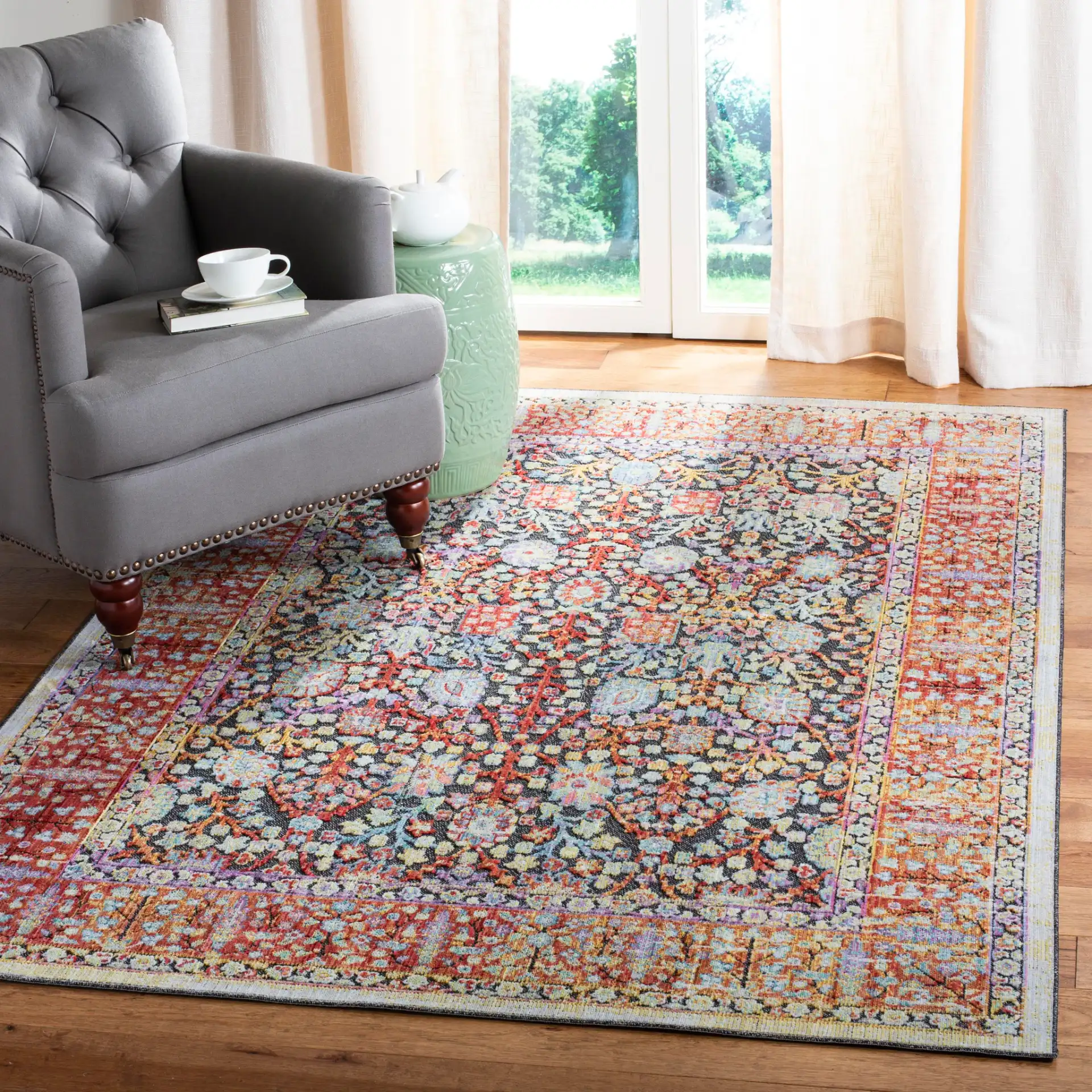 Provance Botanical Border Rug in Red / Black in a styled room