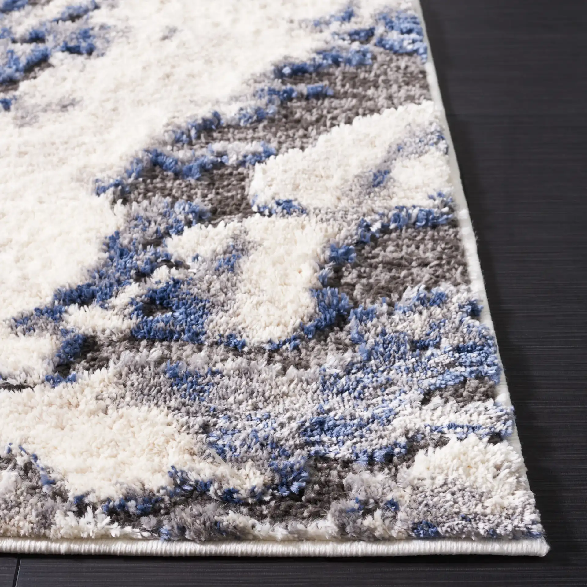 Petra Marbled Rug in Ivory / Blue in a styled room