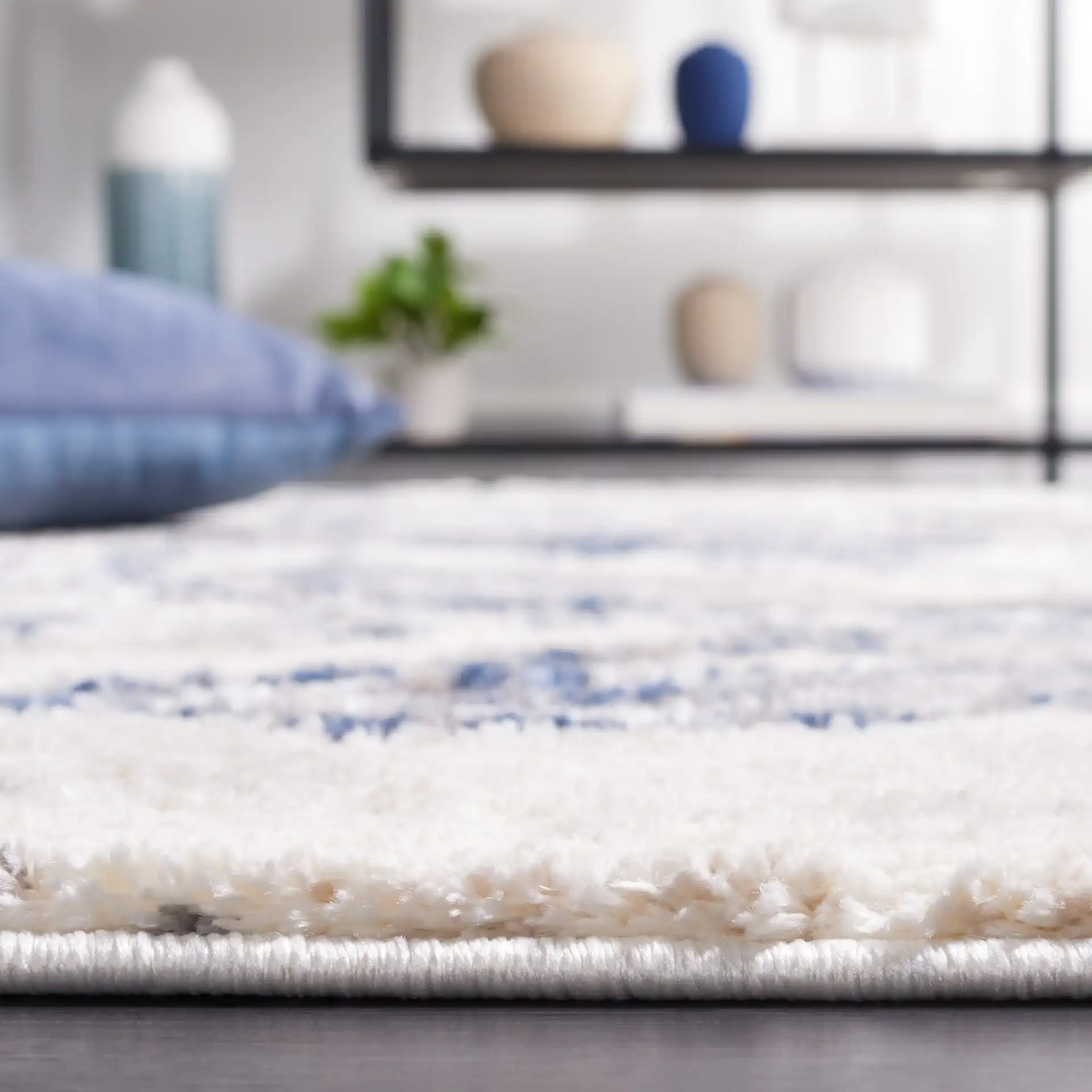 Petra Marbled Rug in Ivory / Blue in a styled room