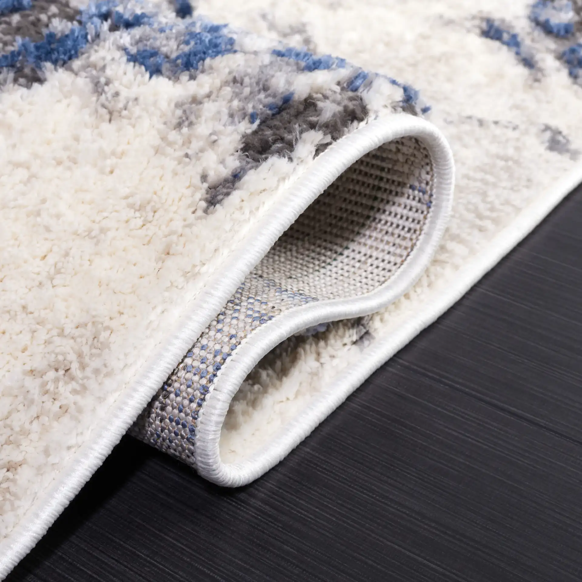 Petra Marbled Rug in Ivory / Blue in a styled room
