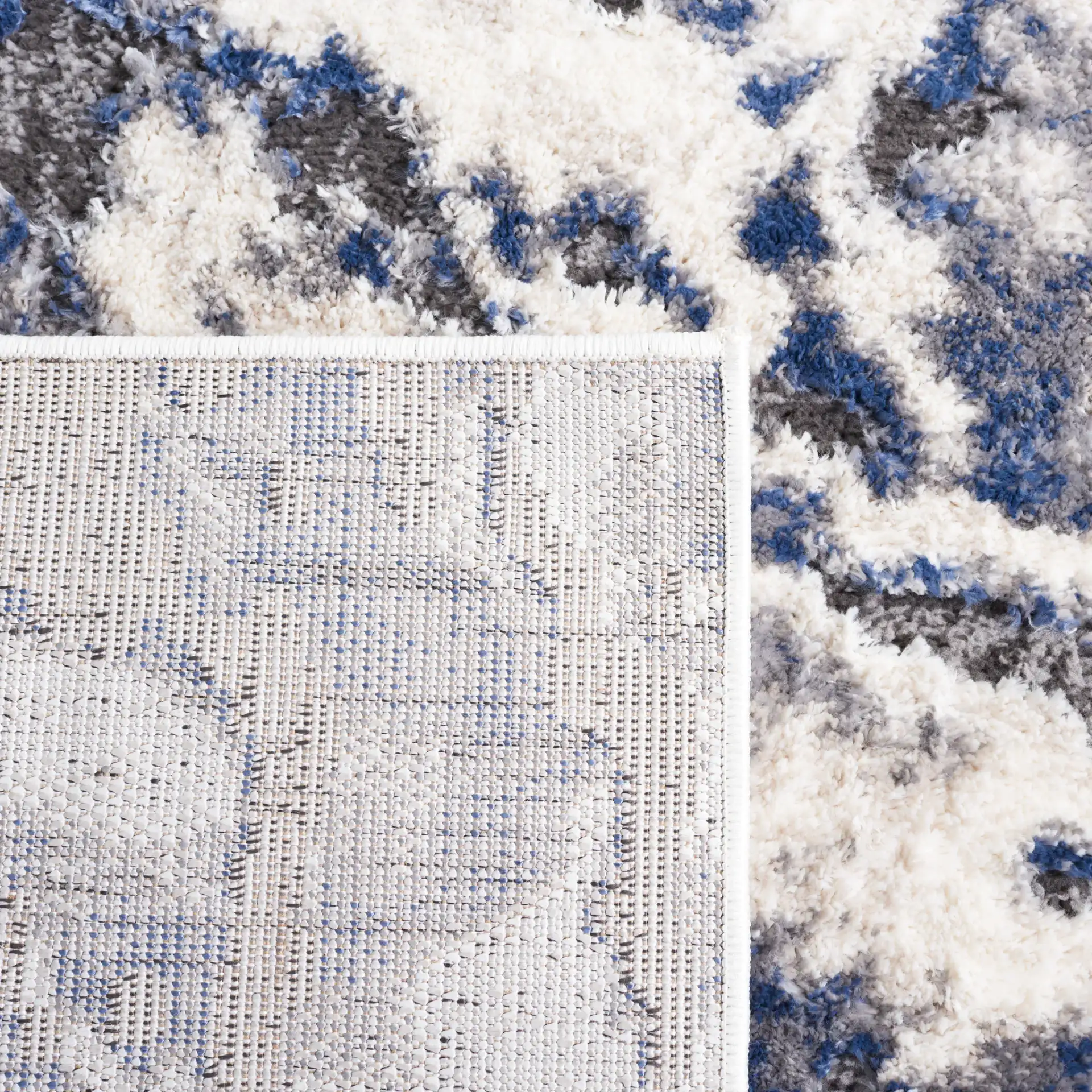 Petra Marbled Rug in Ivory / Blue in a styled room