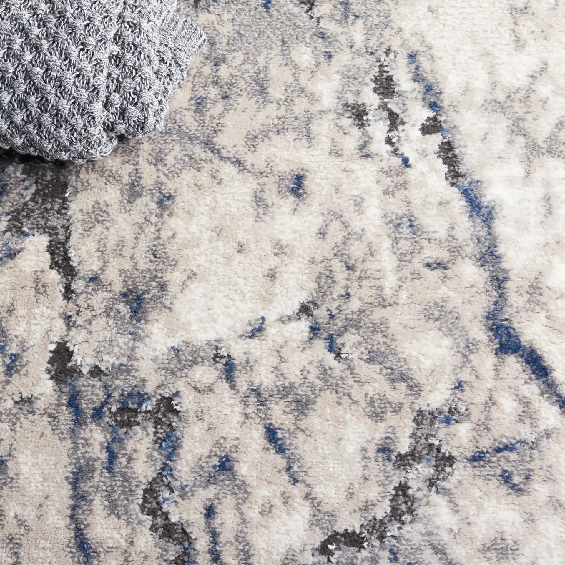 Petra Marble Rug in Ivory / Light Gray in a styled room