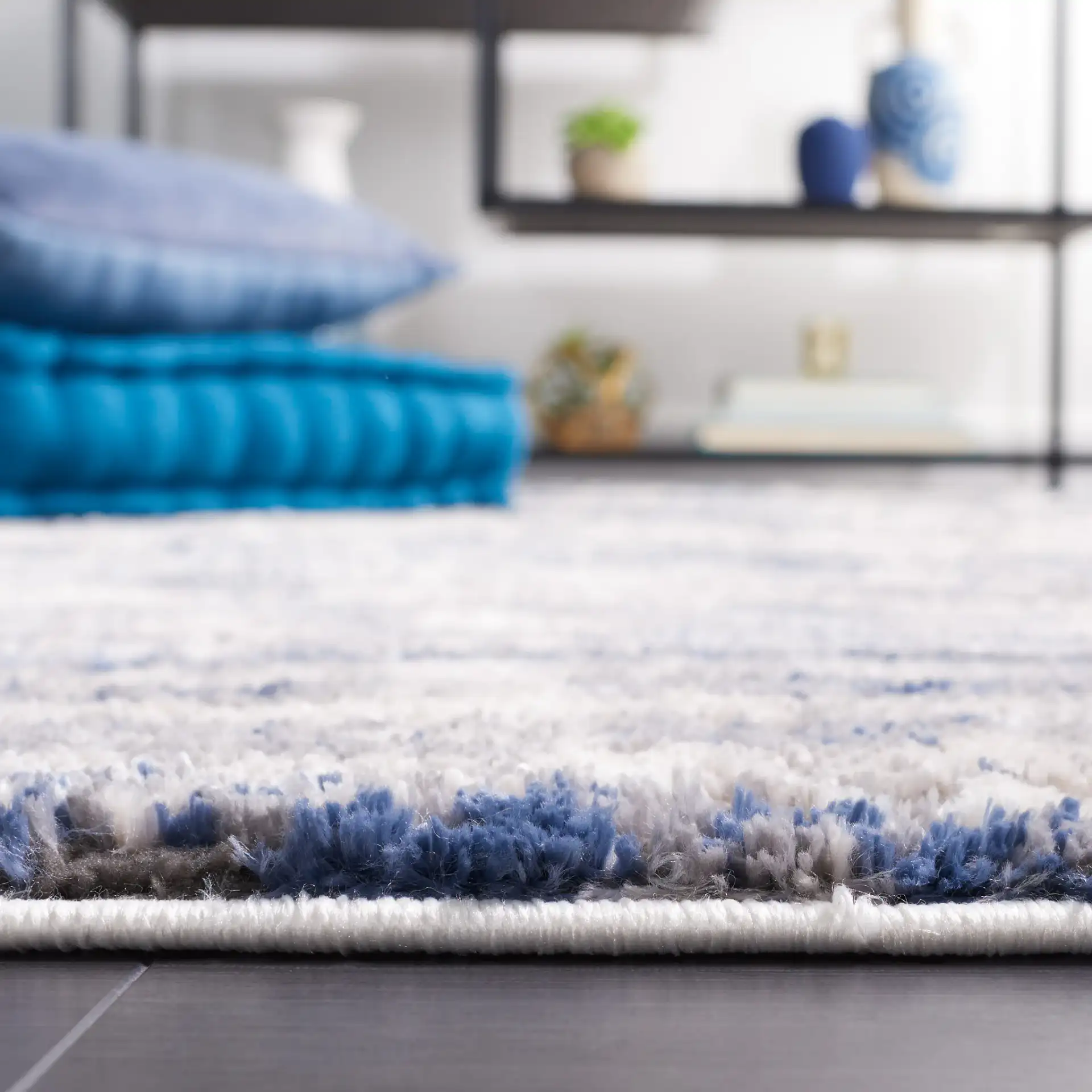 Petra Marble Wave Rug in Light Beige / Blue in a styled room
