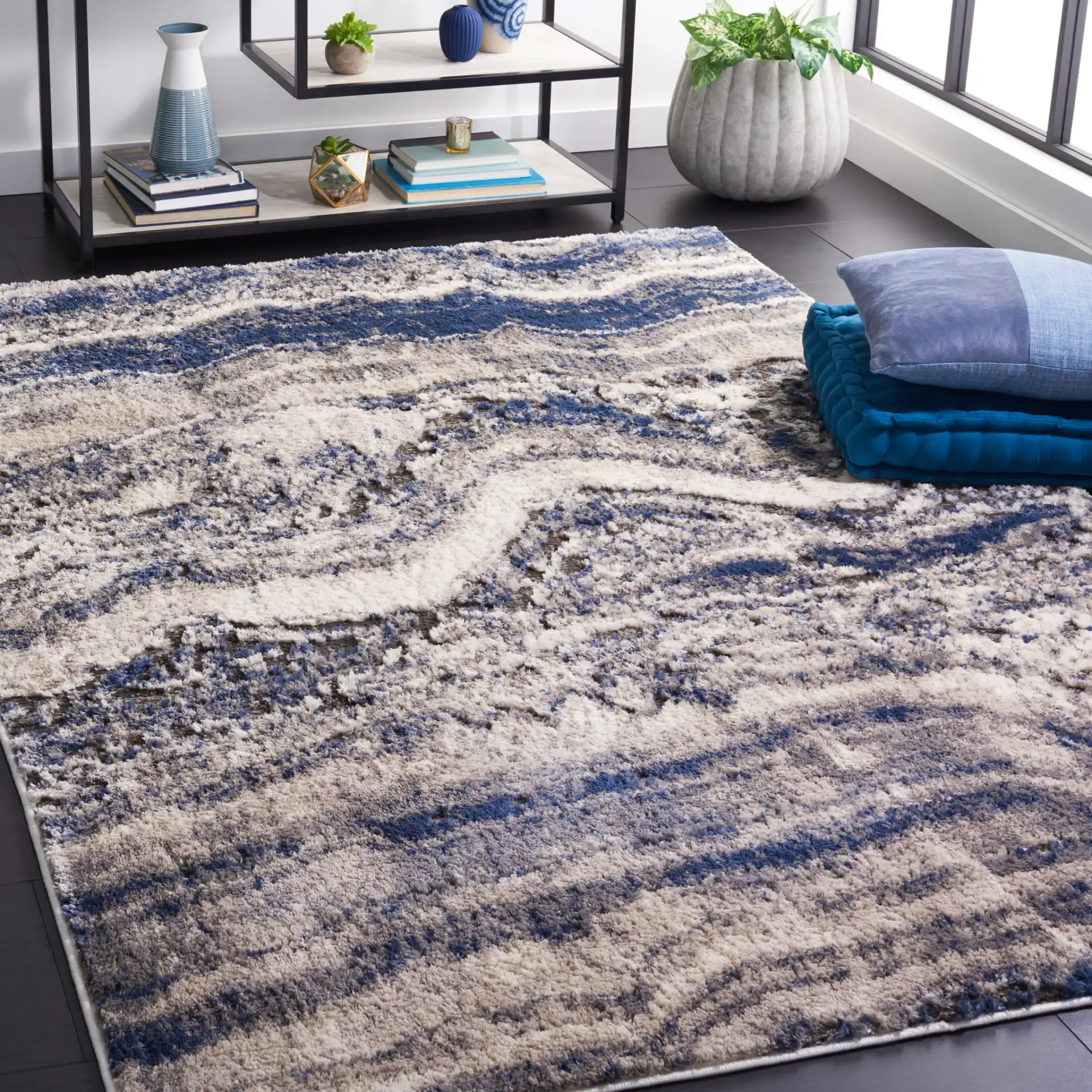 Petra Marble Wave Rug in Light Beige / Blue in a styled room