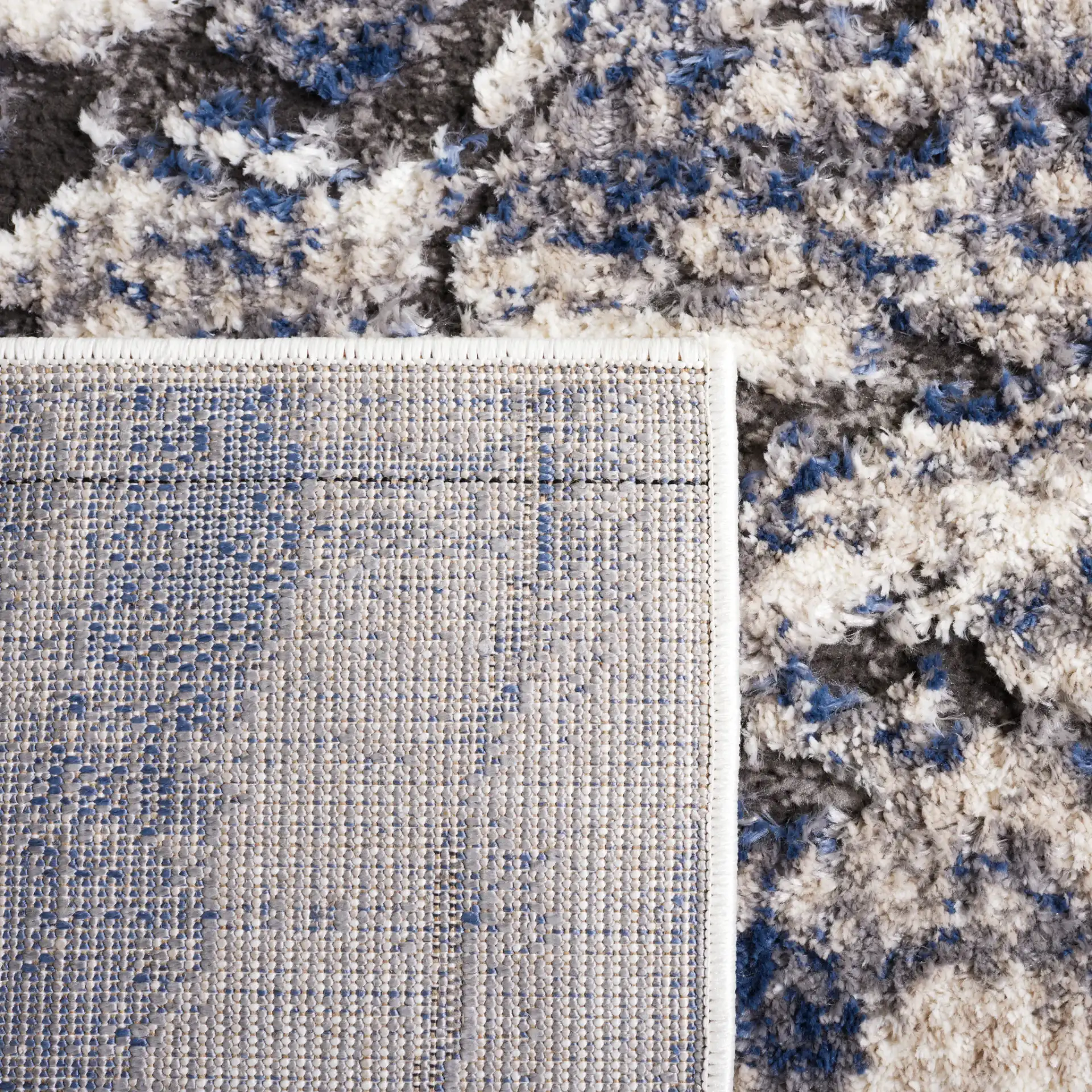 Petra Marble Wave Rug in Light Beige / Blue in a styled room