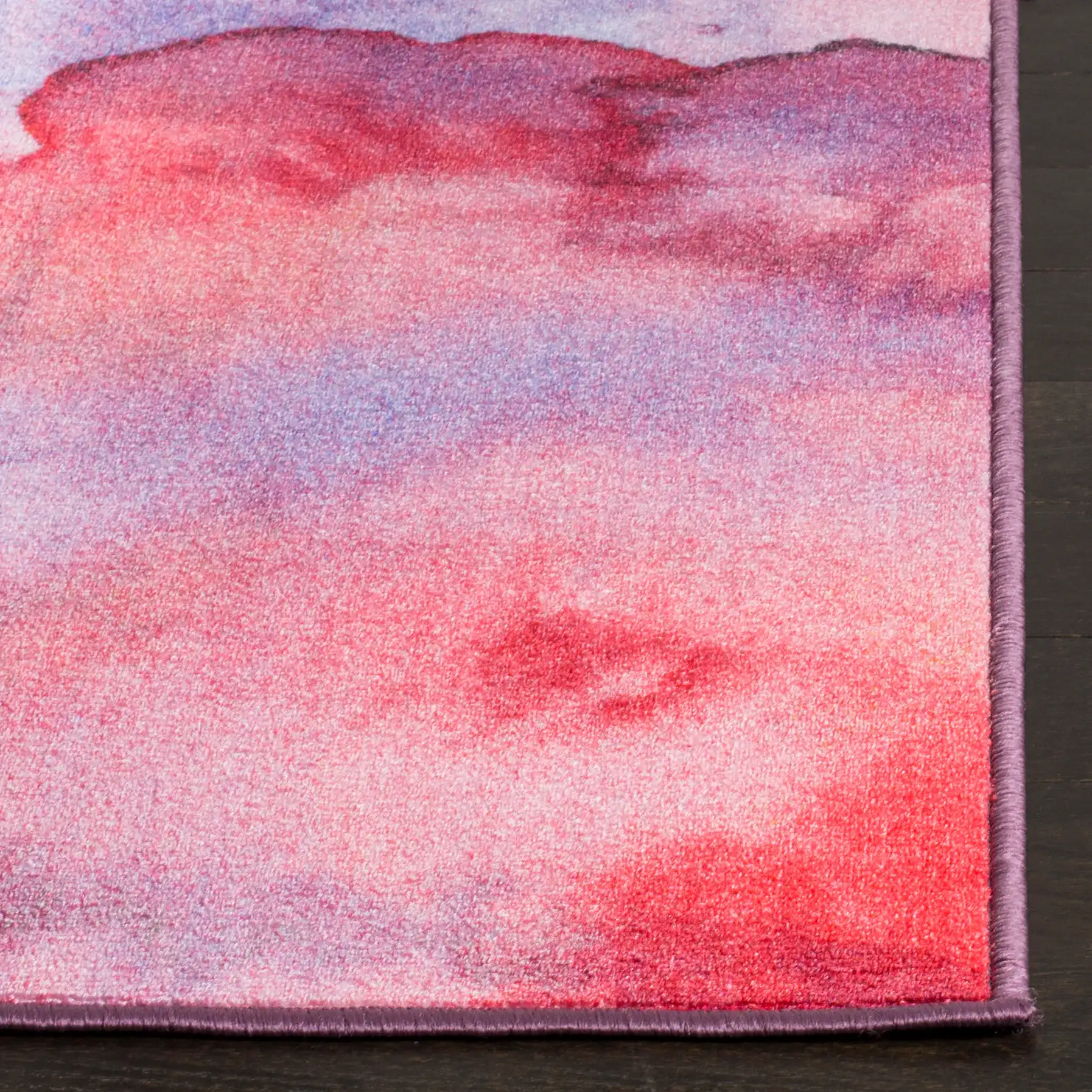 Paint Brush Abstract Washable Rug in Fuchsia / Lavender in a styled room