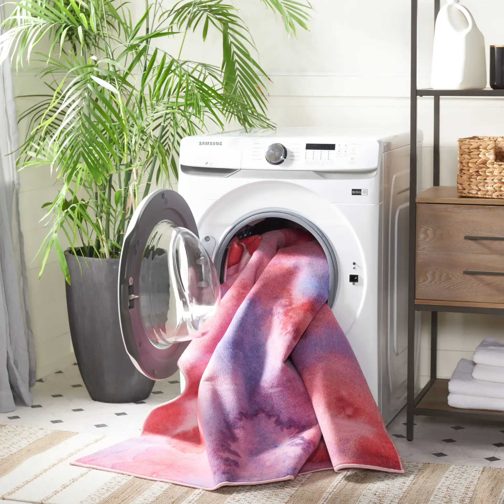 Paint Brush Abstract Washable Rug in Fuchsia / Lavender in a styled room