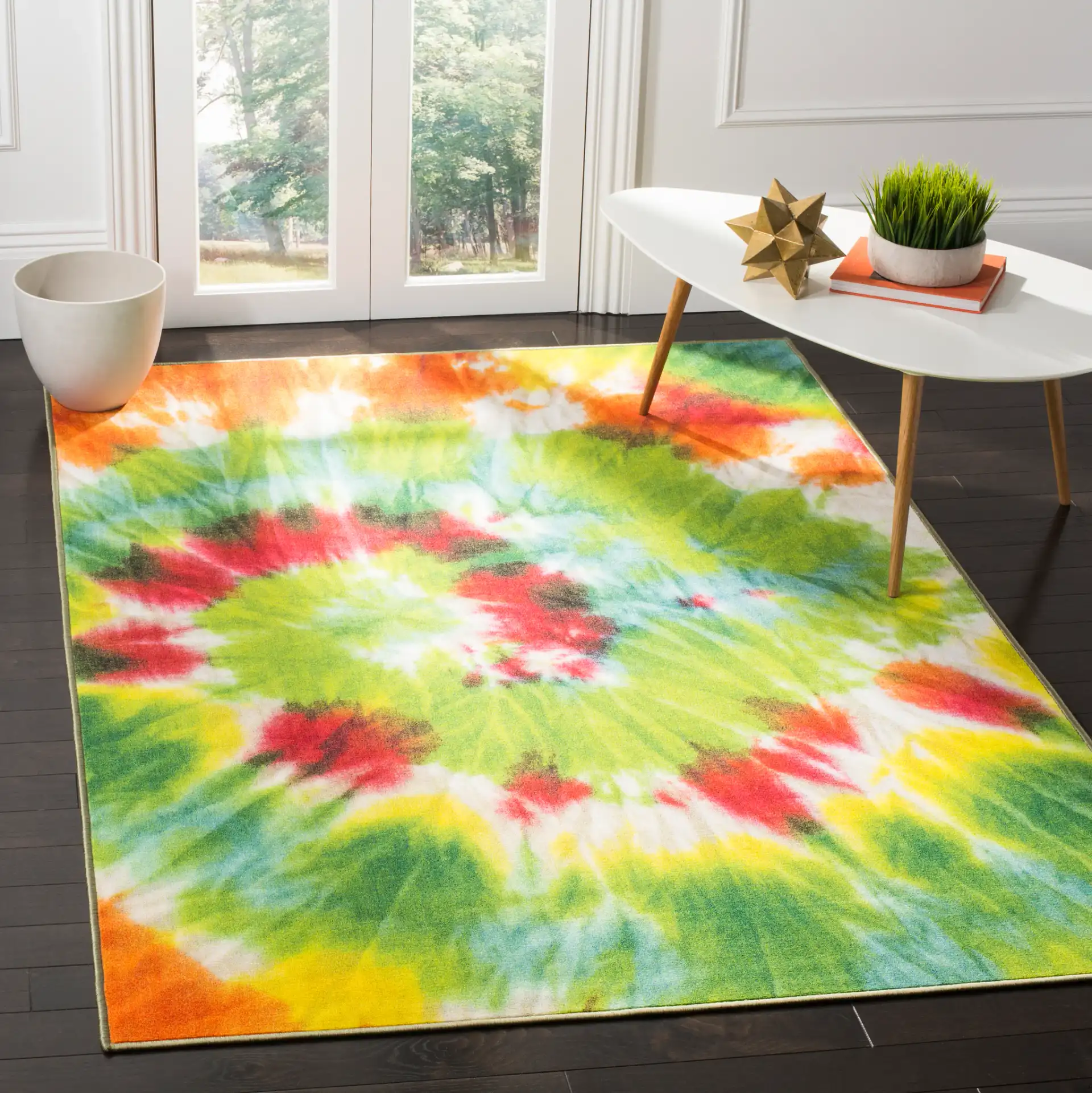 Paint Brush Tie-Dye Swirl Washable Rug in Green / Orange in a styled room