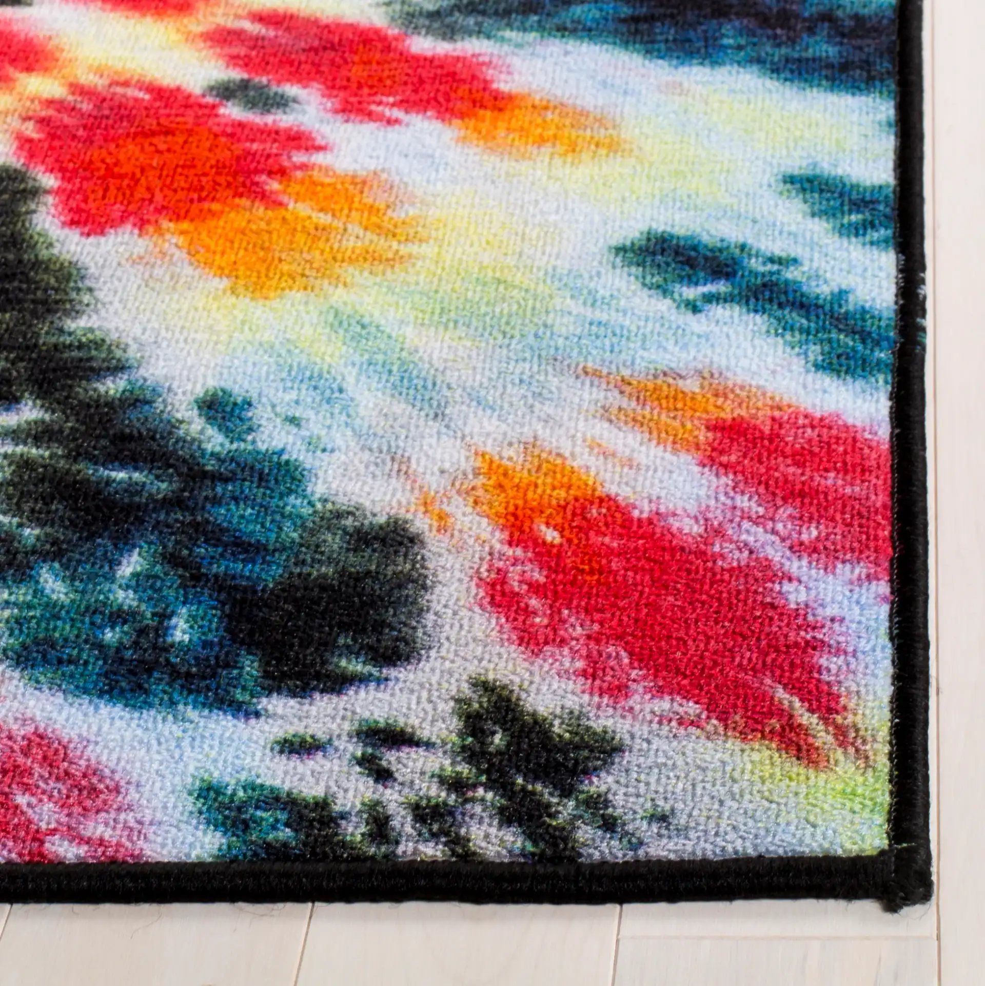 Paint Brush Tie-Dye Spiral Washable Rug in Black / Coral in a styled room