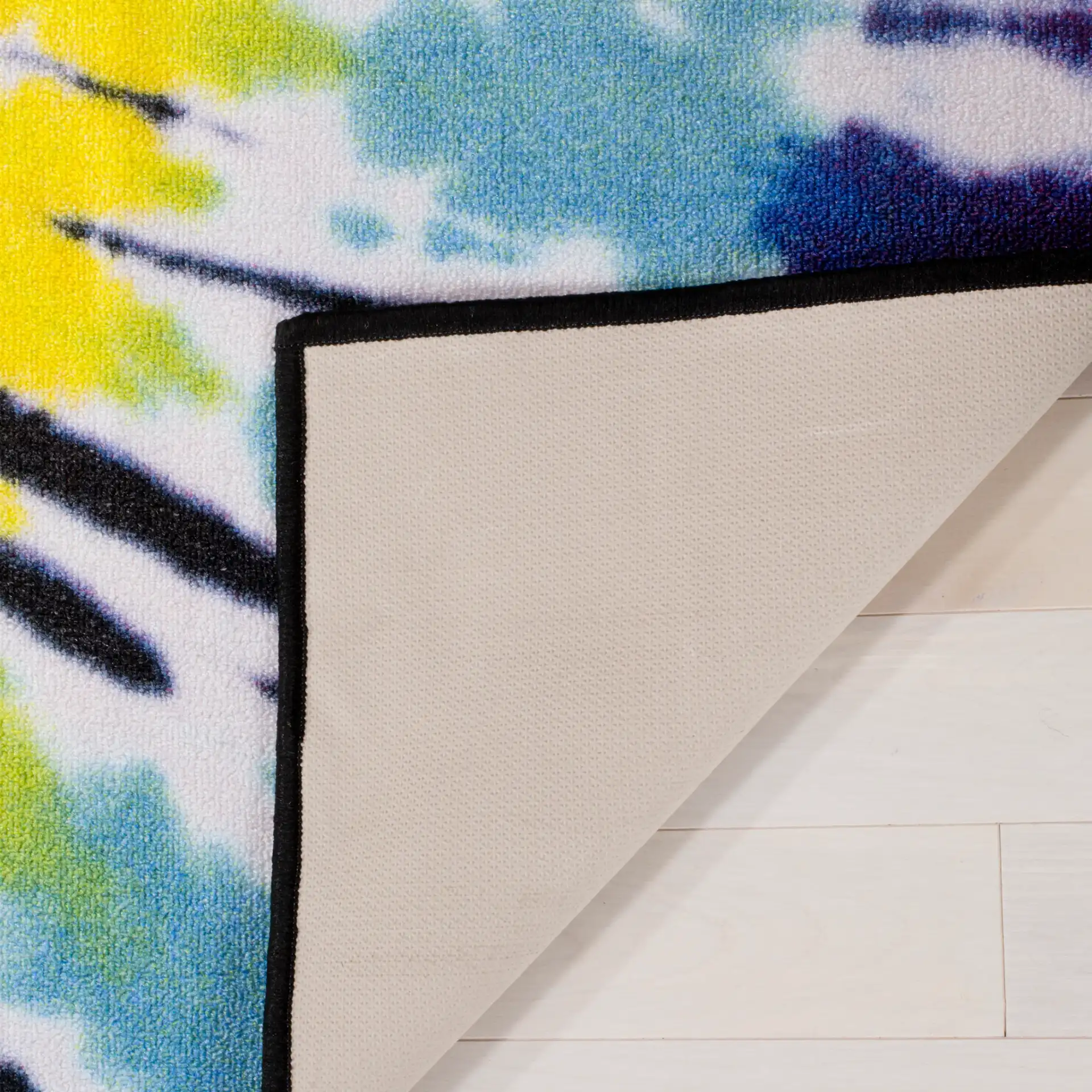 Paint Brush Tie-Dye Washable Rug in Fuchsia / Yellow in a styled room
