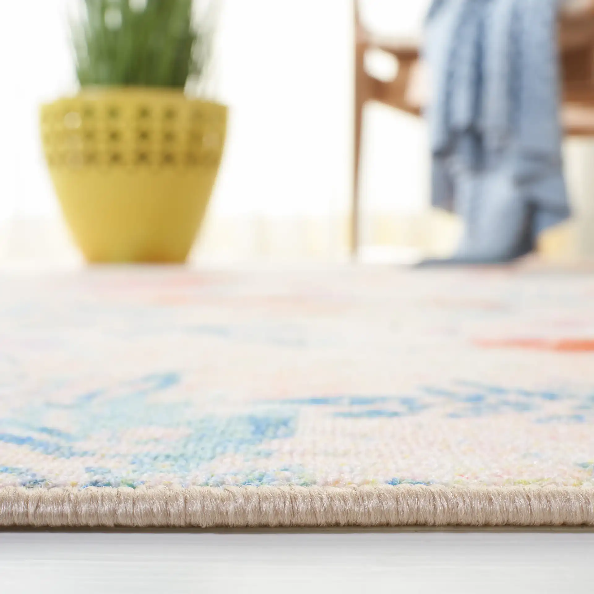 Paint Brush Modern Floral Washable Rug in Blue / Blush Pink in a styled room
