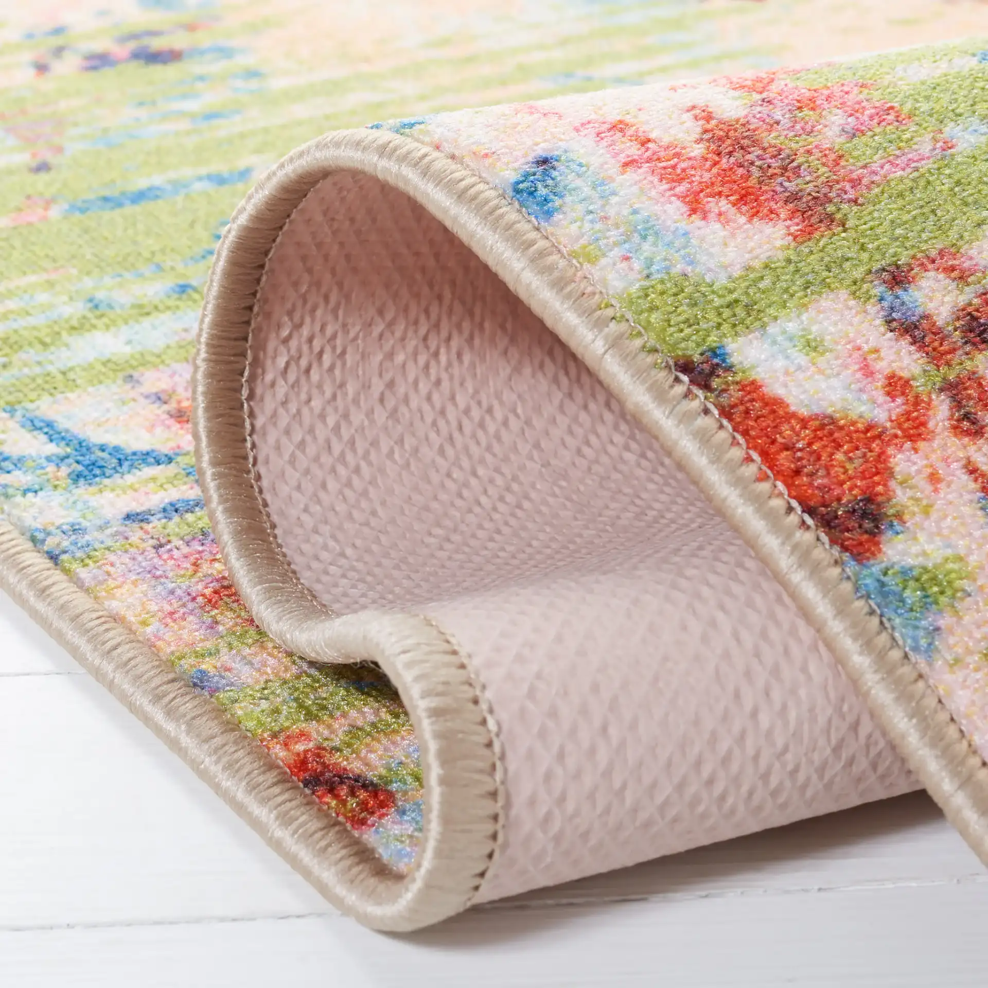 Paint Brush Modern Floral Washable Rug in Blue / Blush Pink in a styled room