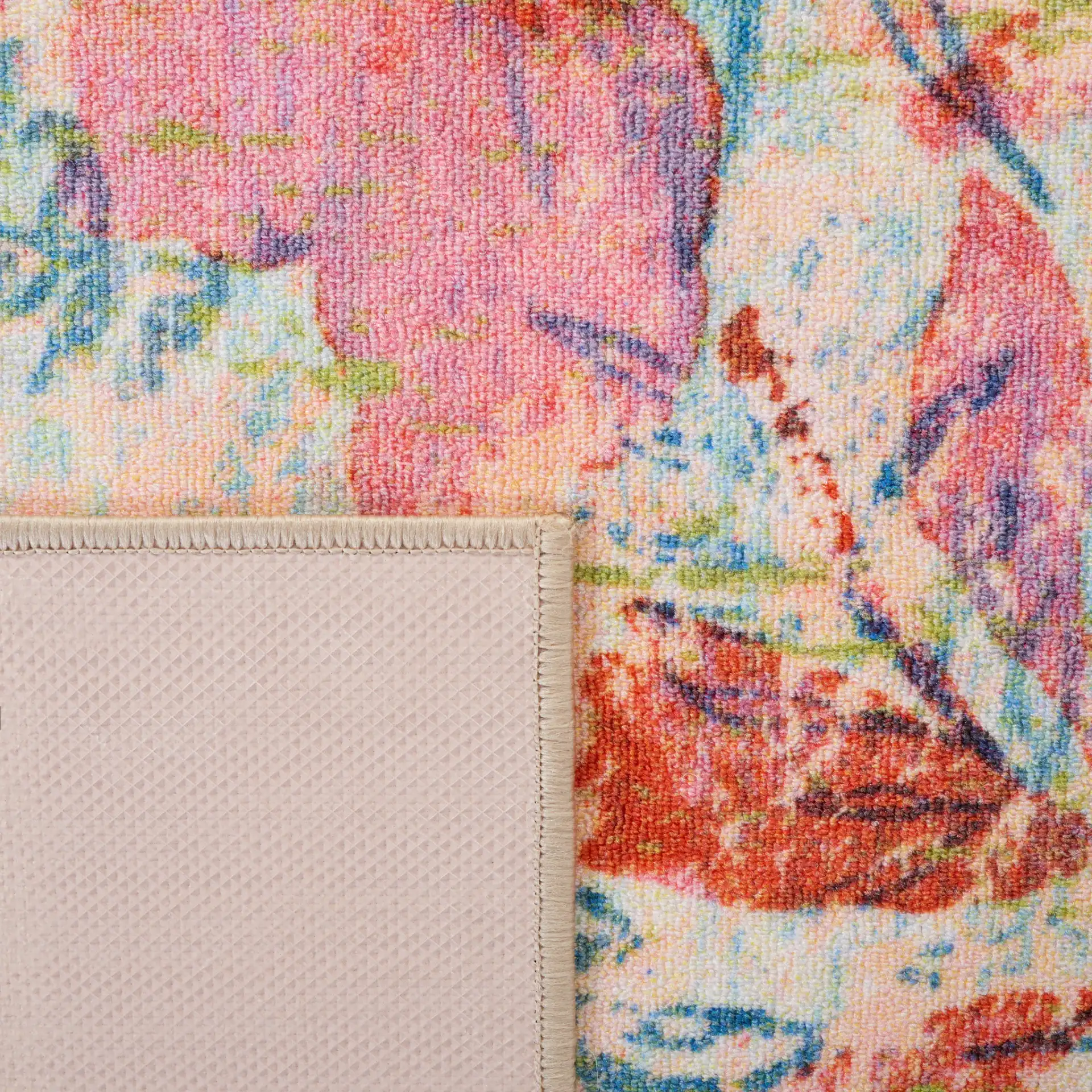 Paint Brush Modern Floral Washable Rug in Blue / Blush Pink in a styled room