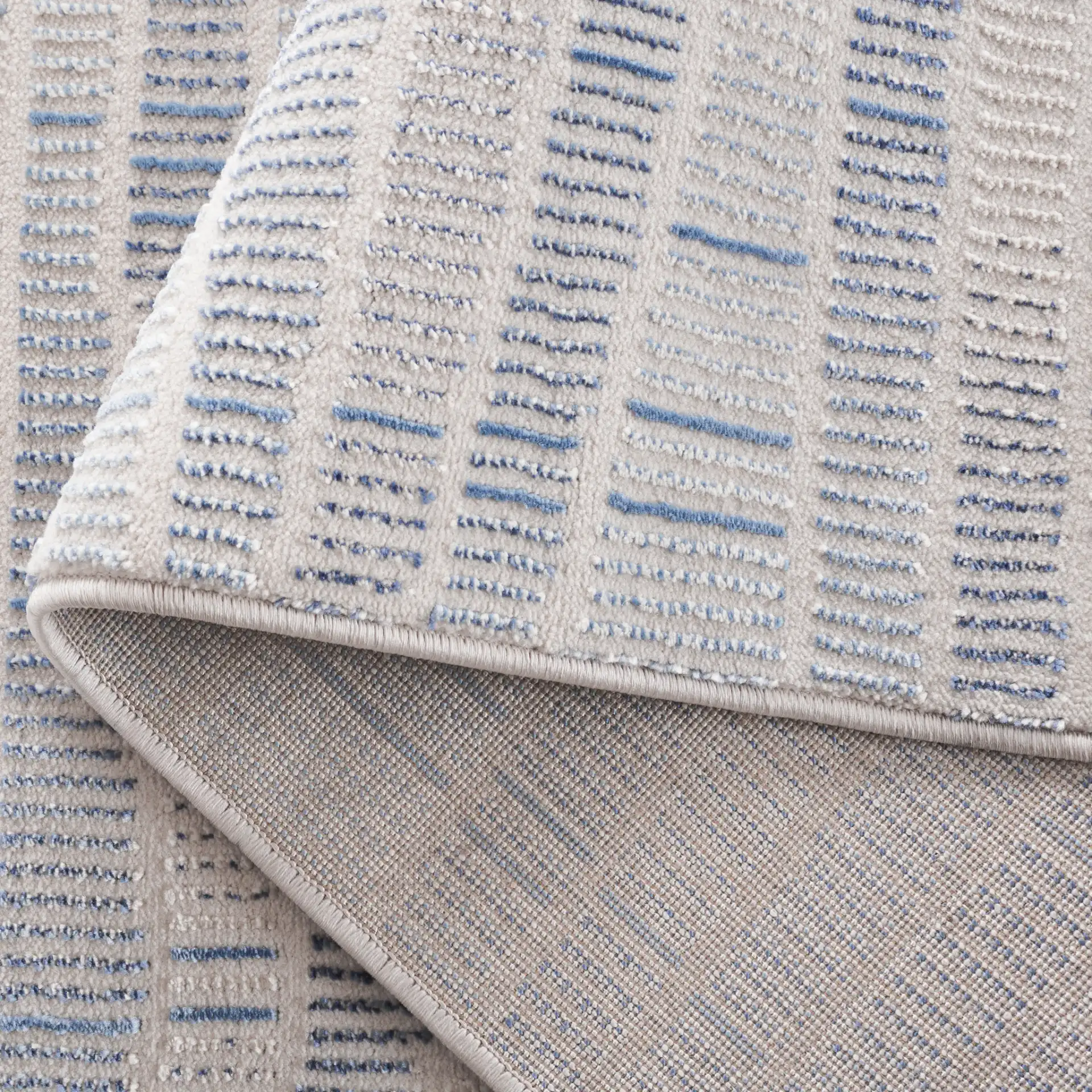 Prestige Dashed Wave Rug in Beige / Blue in a styled room