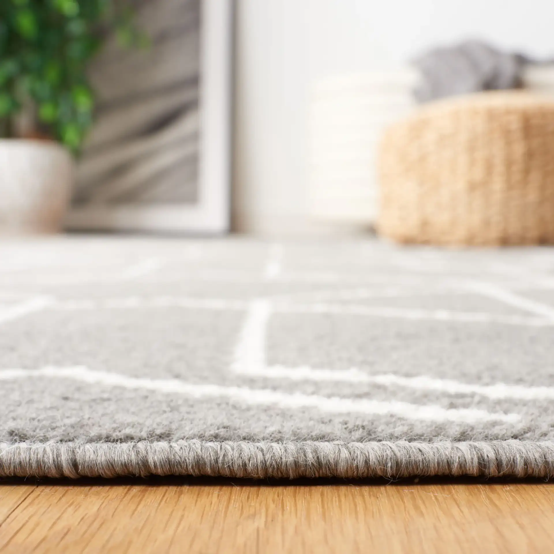 Pyramid Interlocking Cube Rug in Gray / Ivory in a styled room