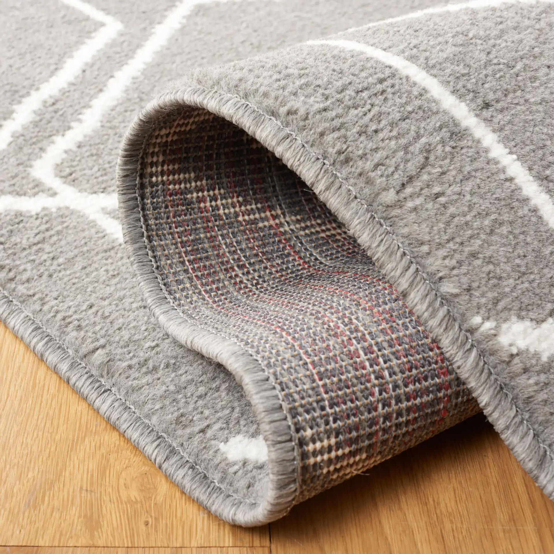 Pyramid Interlocking Cube Rug in Gray / Ivory in a styled room